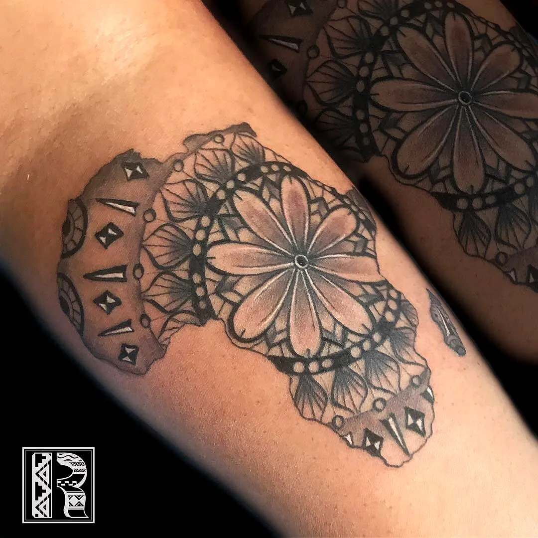 Intricate Africa Arm Tattoo in Black and Gray