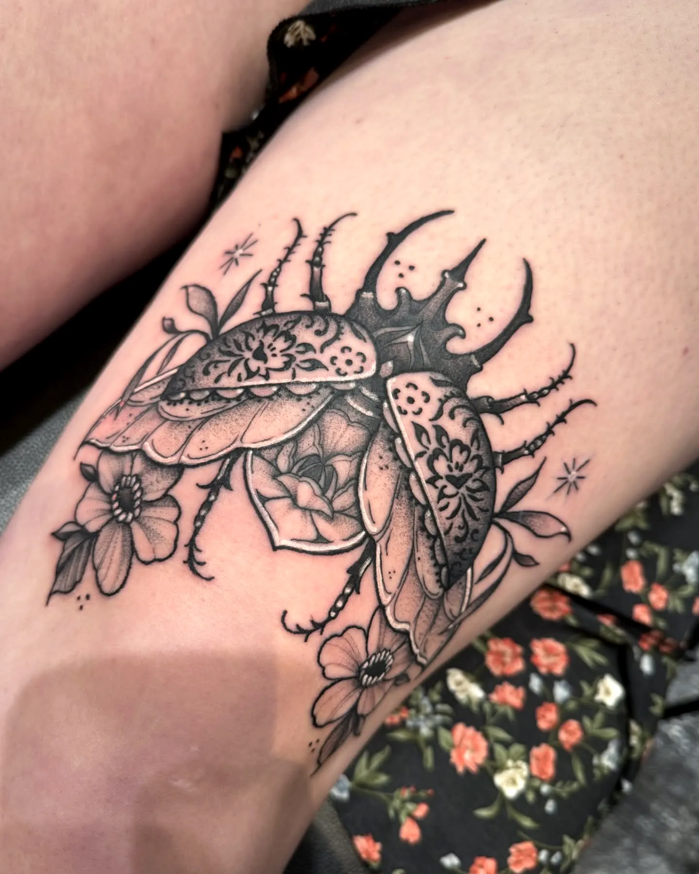 Intricate Beetle Arm Tattoo with Flowers