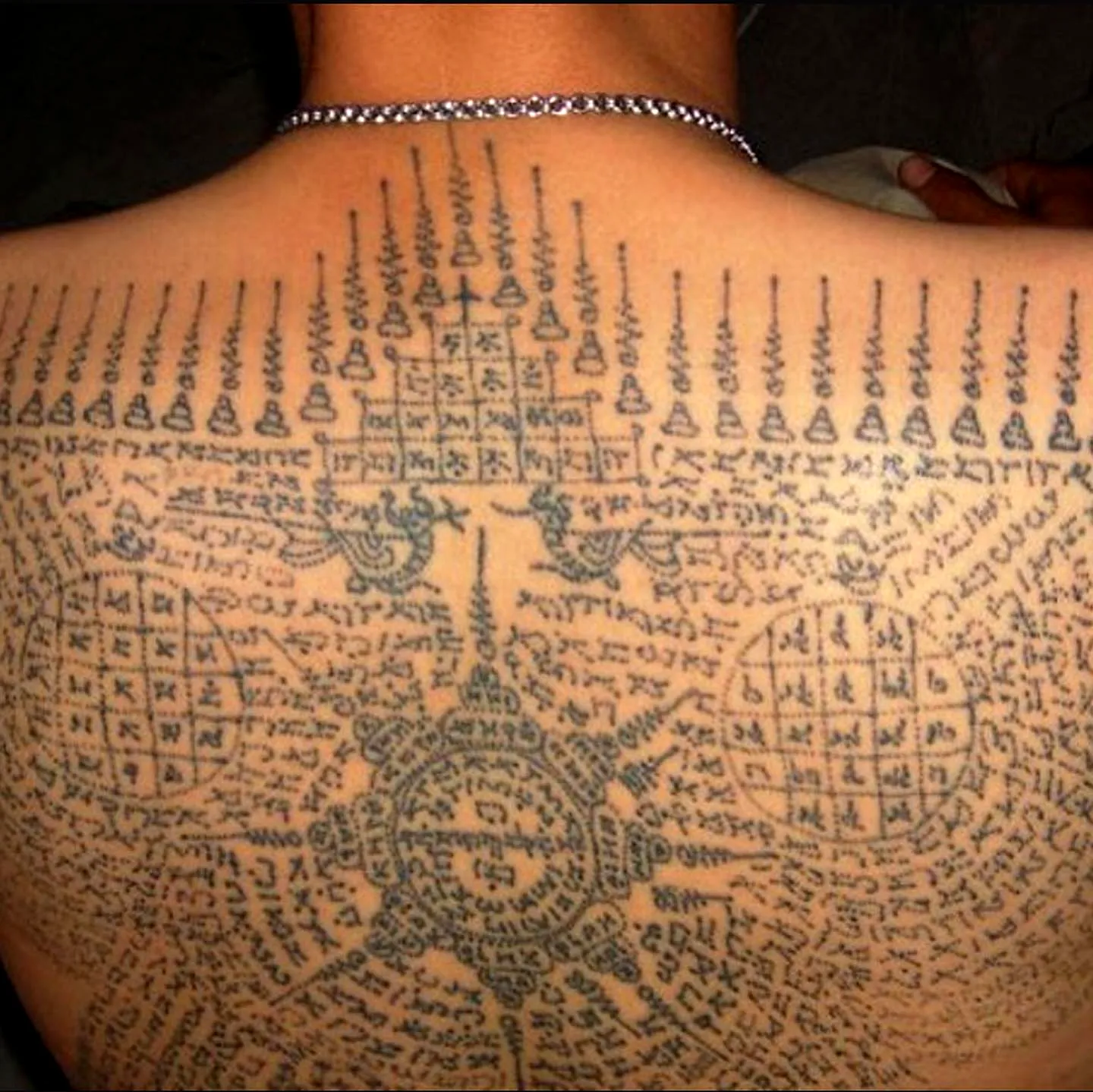 Intricate Black Back Tattoo Design