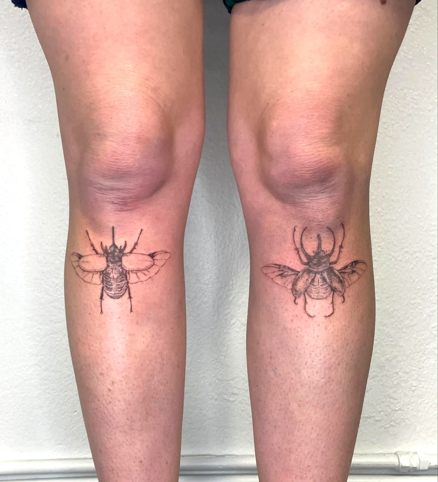 Intricate Black Bee Knee Tattoos