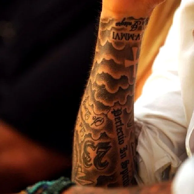 Intricate Black Ink Forearm Tattoo