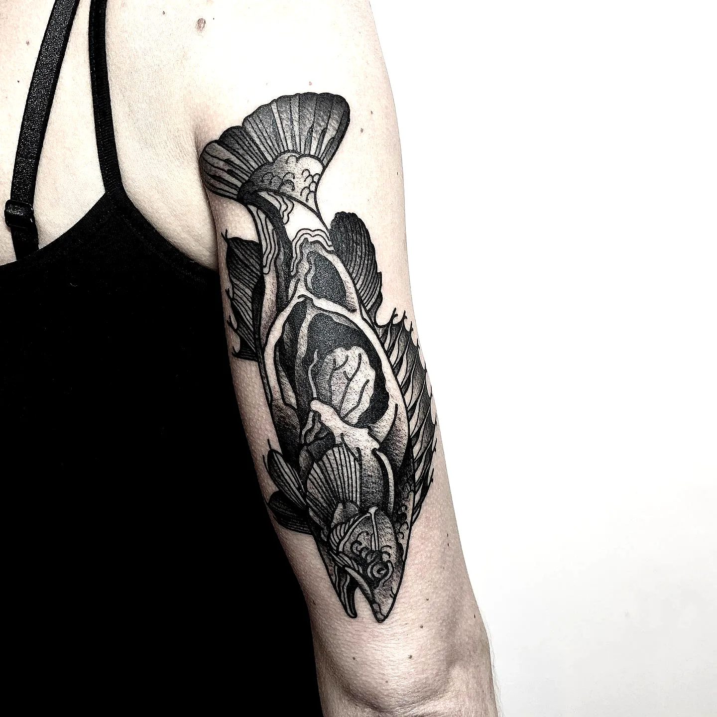 Intricate Bonefish Upper Arm Tattoo