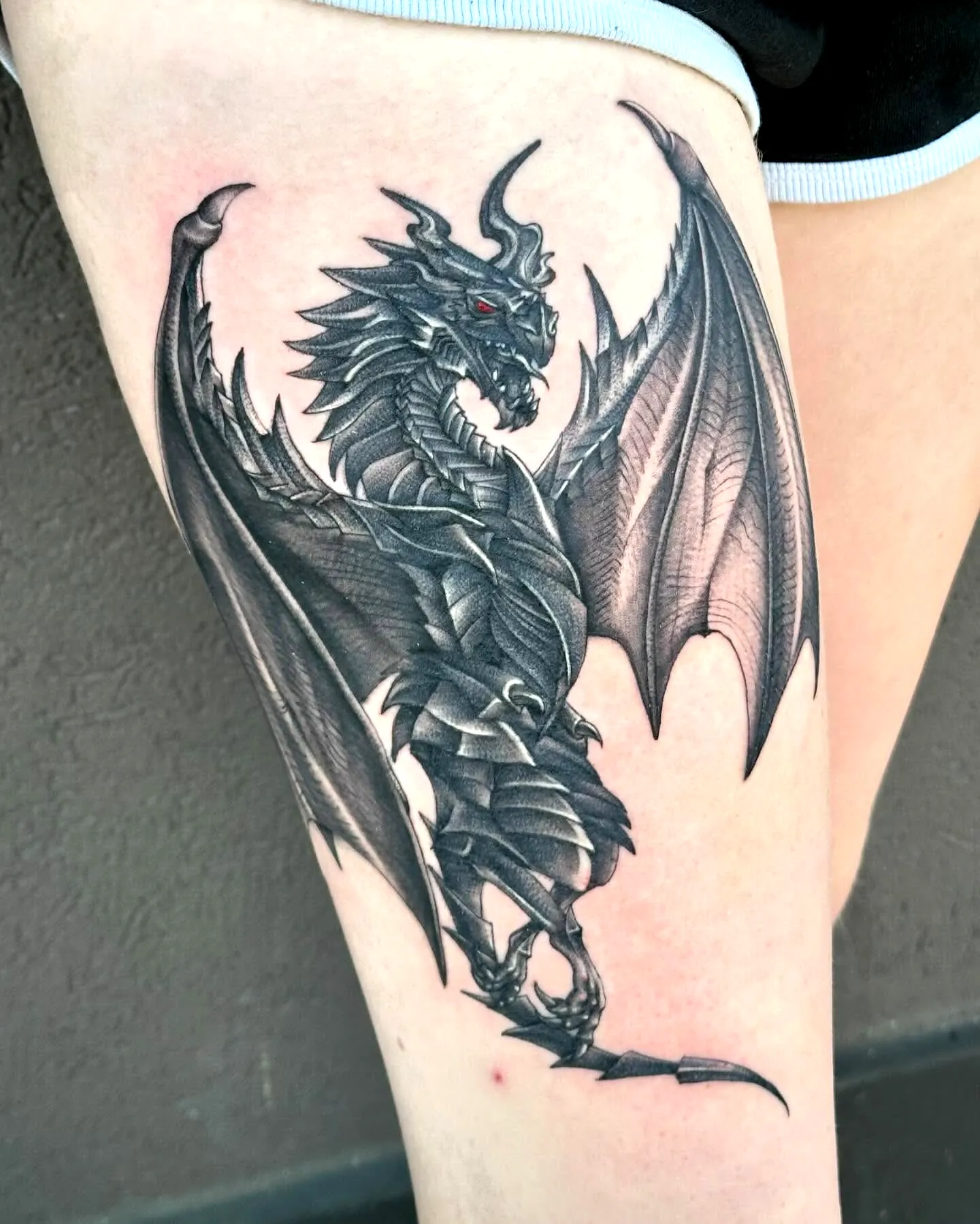 Intricate Dragon Thigh Tattoo in Black Grey