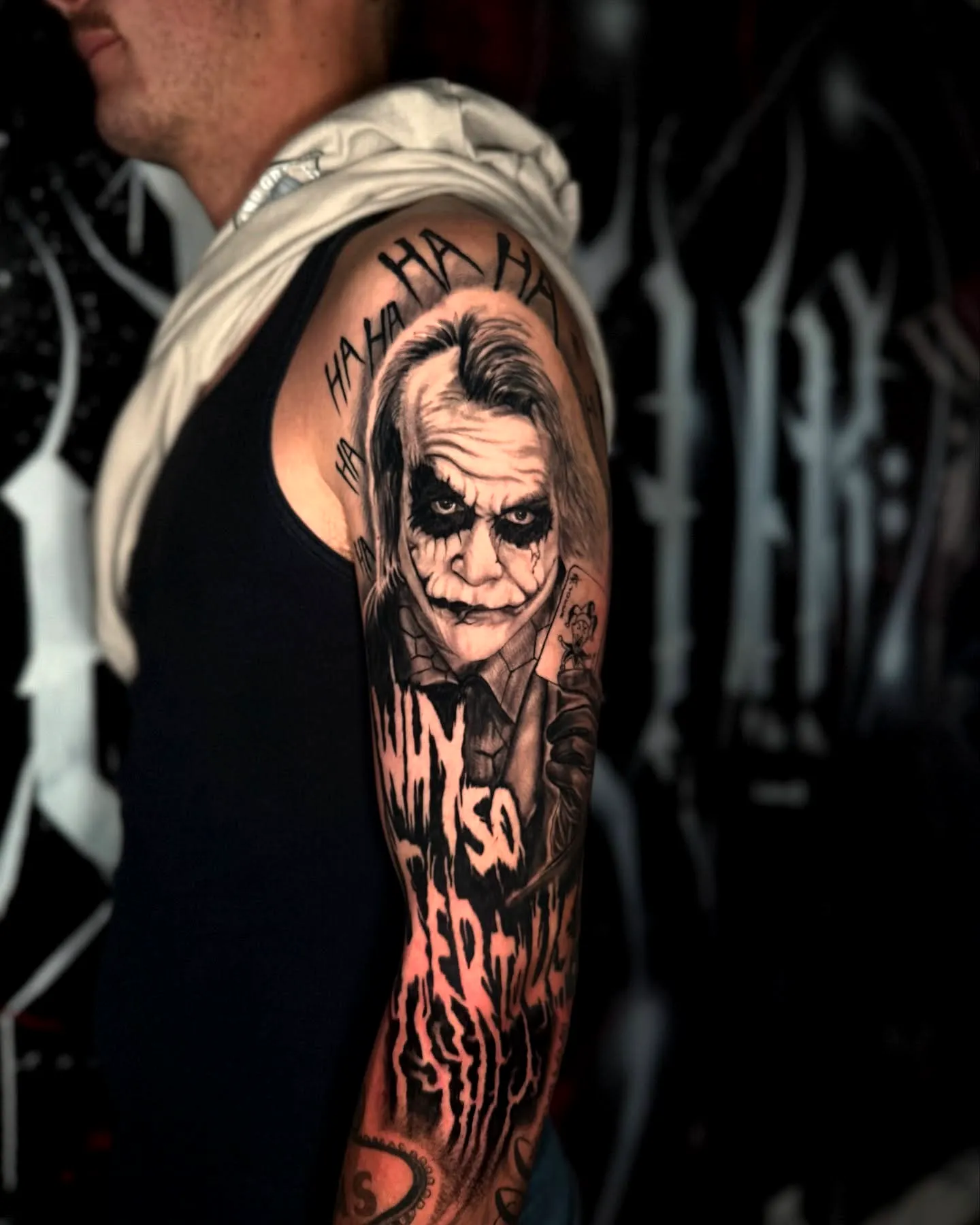 Joker Upper Arm Tattoo in Black and Gray