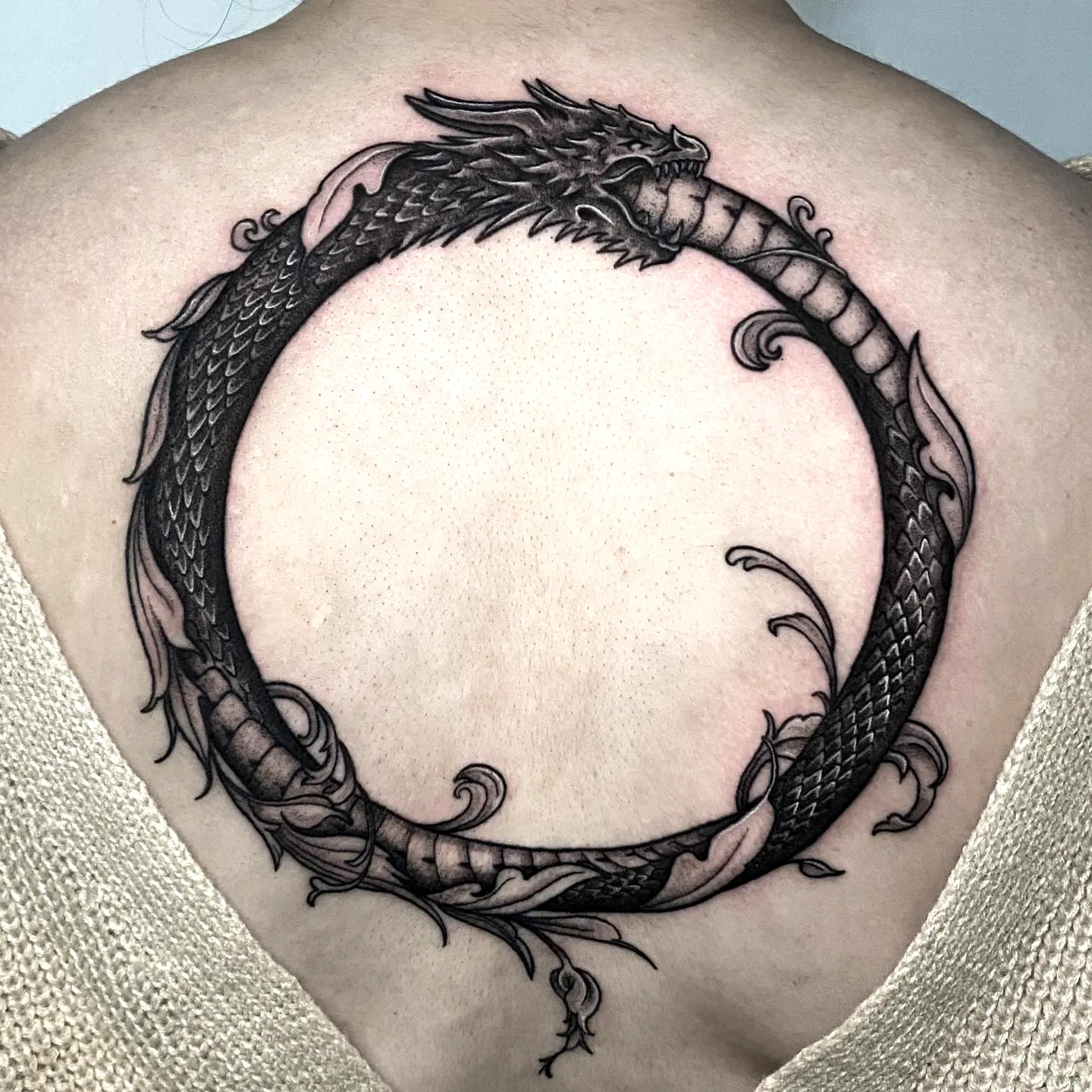 Jormungandr Back Tattoo with Floral Elements
