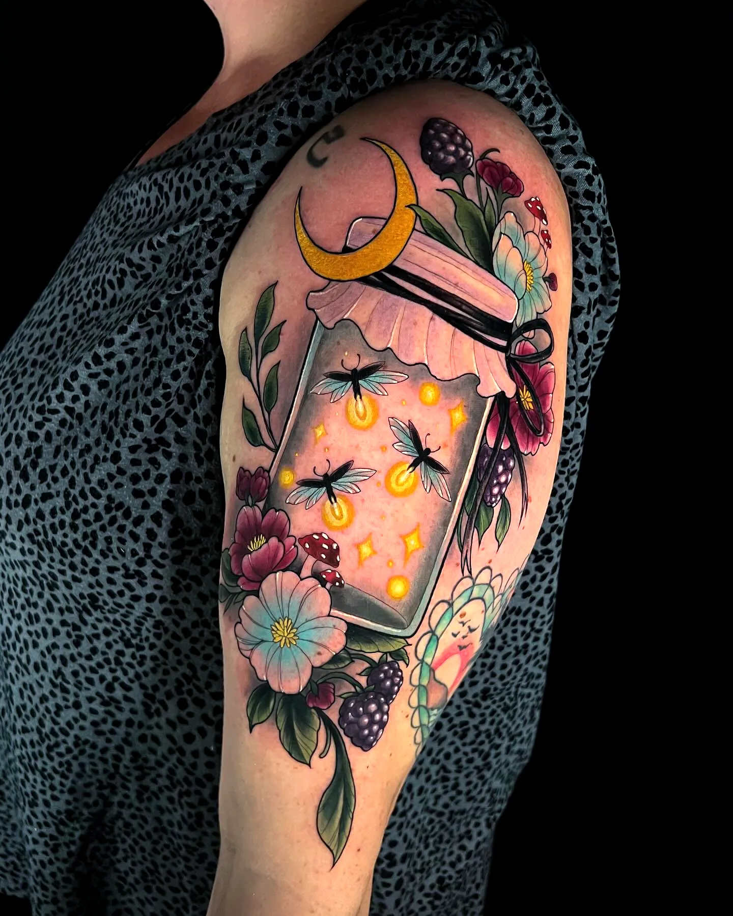 Lantern Upper Arm Tattoo with Flowers