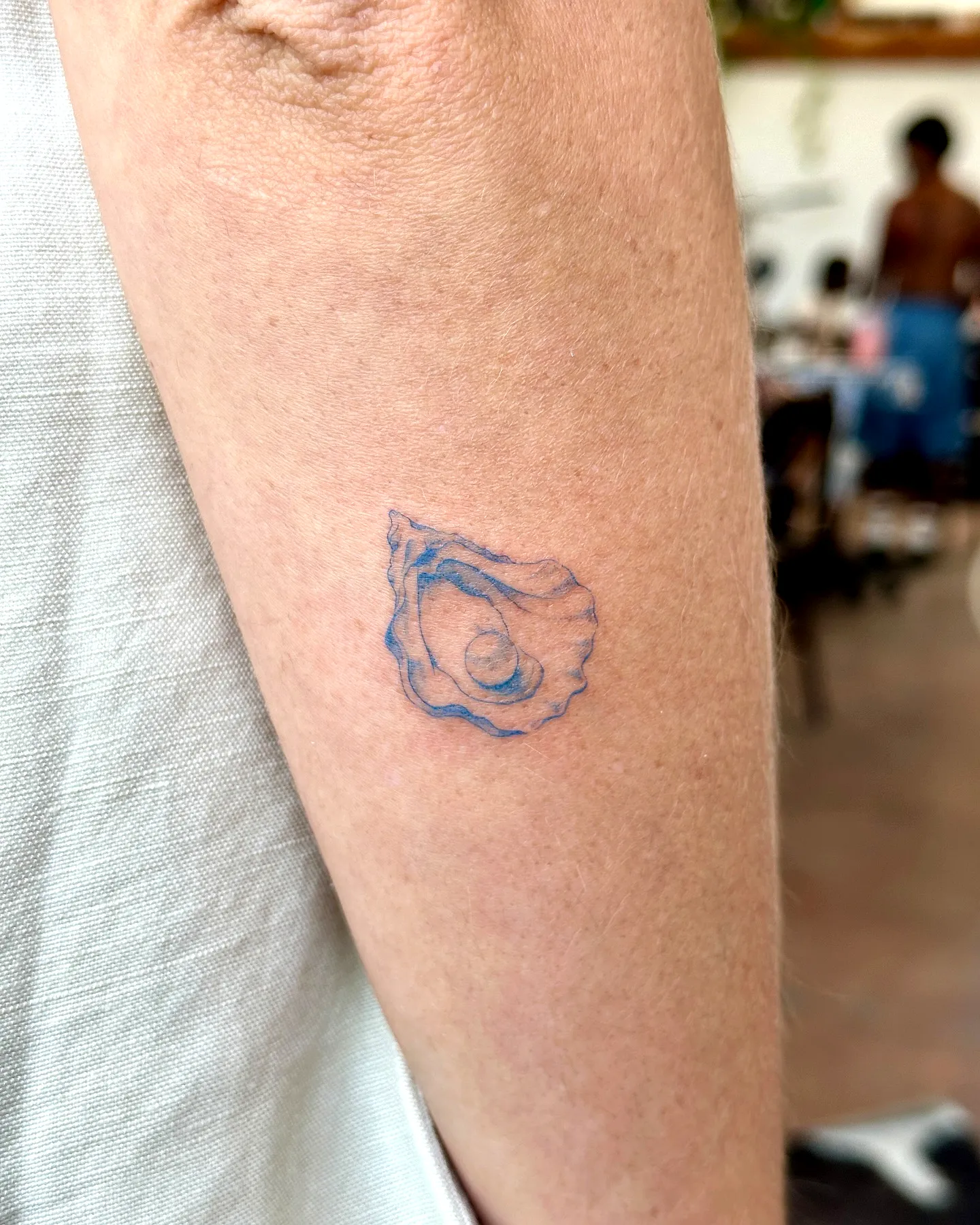 Light Blue Oyster Inner Forearm Tattoo