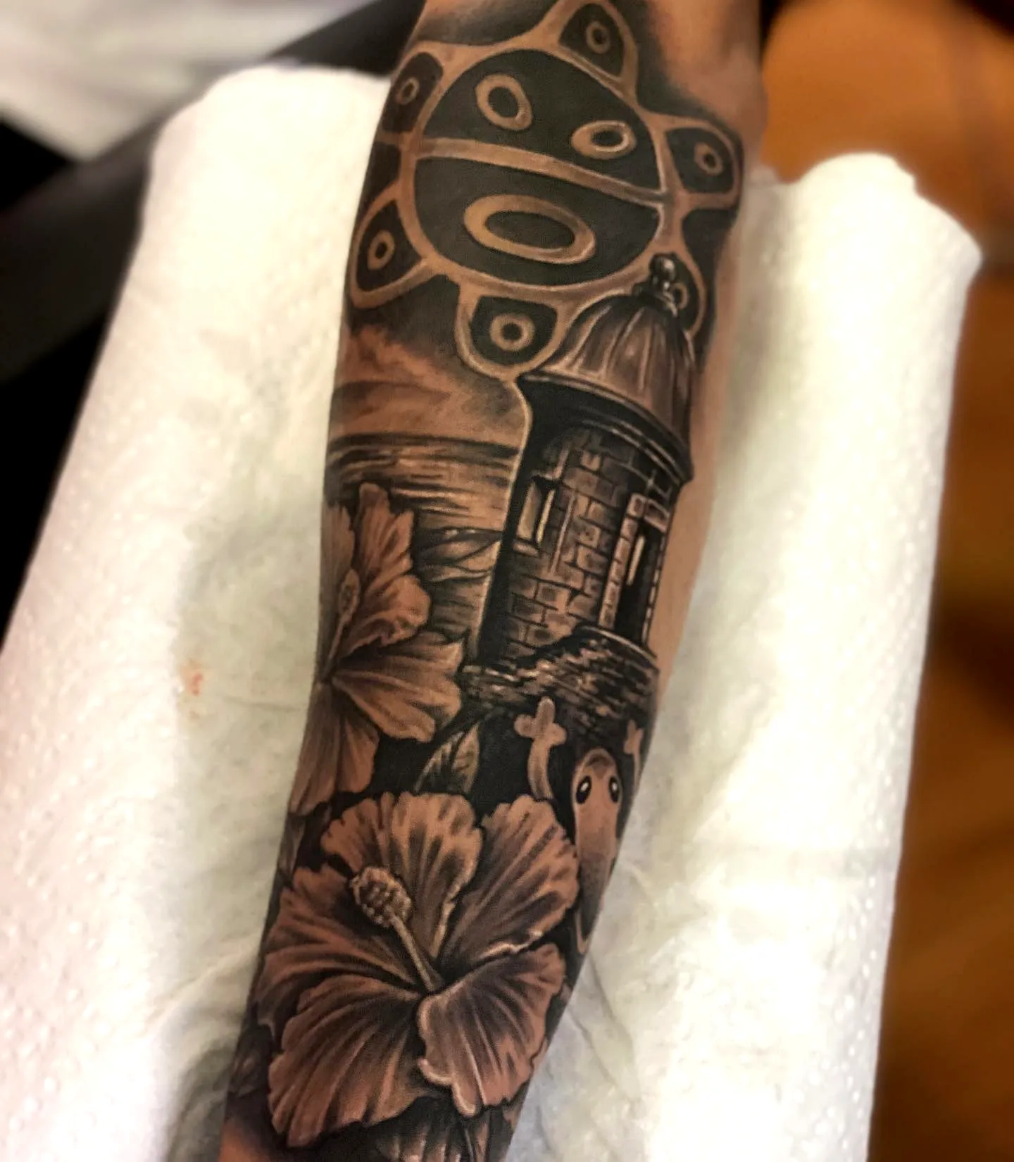 Lighthouse Arm Tattoo with Hibiscus Flowers