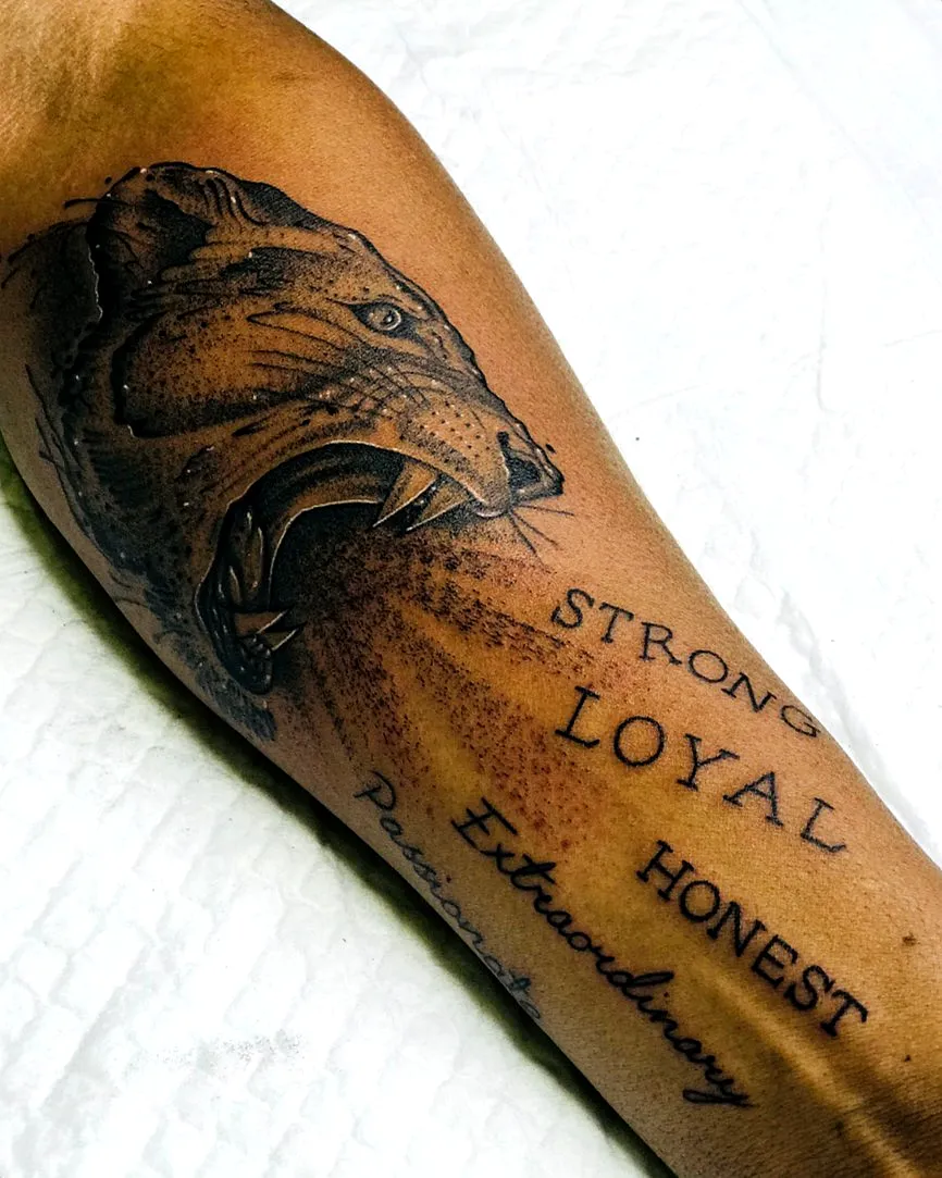 Lion Forearm Tattoo with Honesty Elements