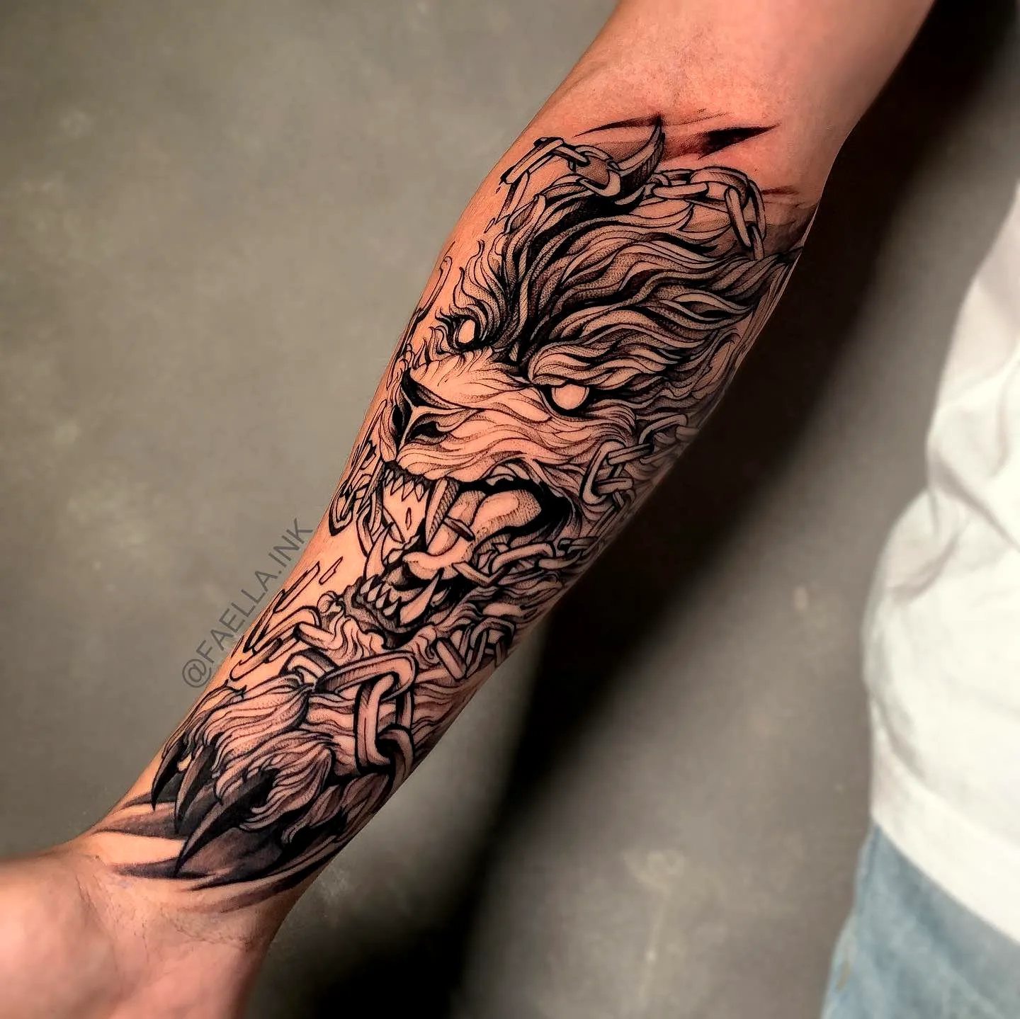 Lion Head Forearm Tattoo in Black and Gray