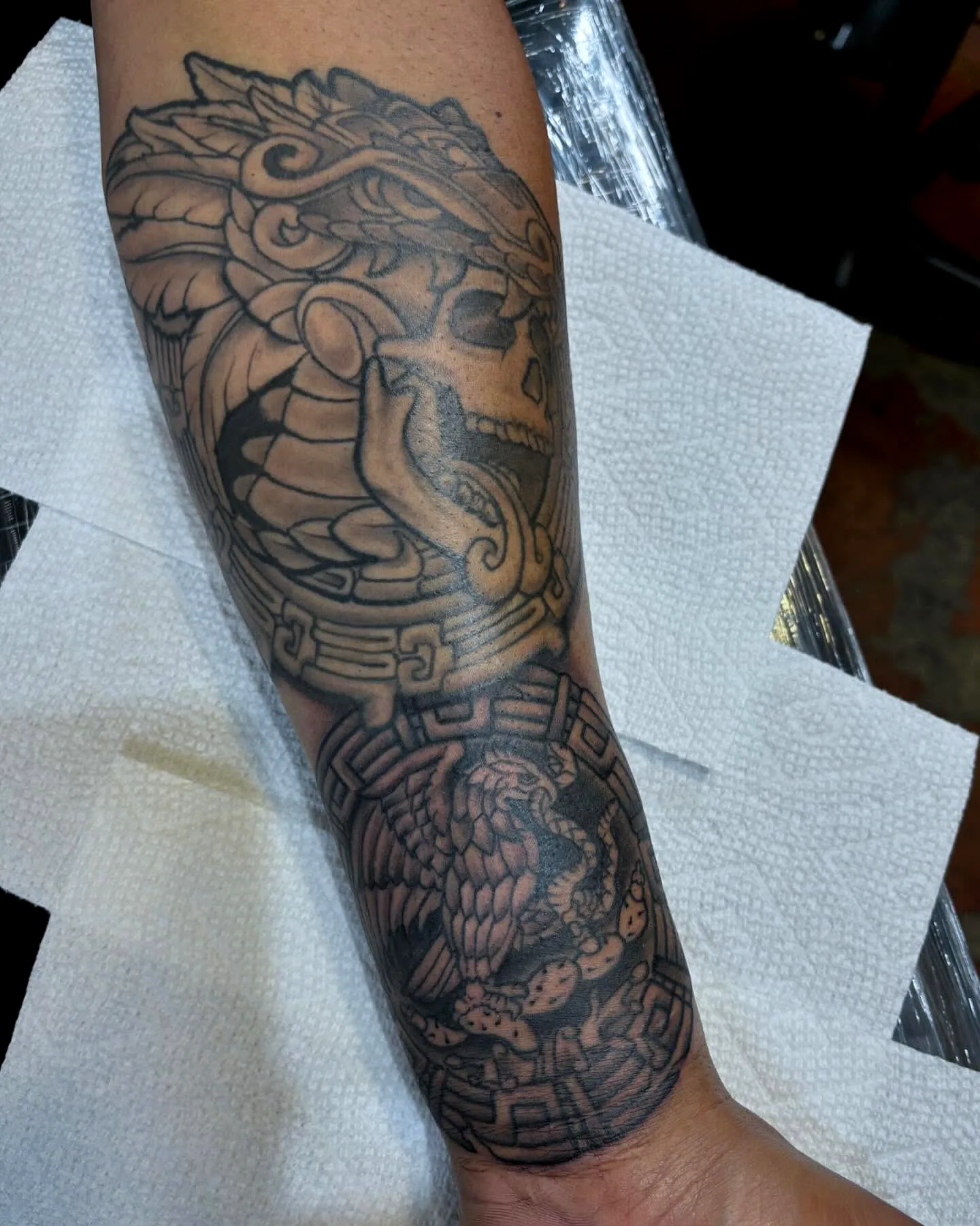 Lion Head Serpent Forearm Tattoo