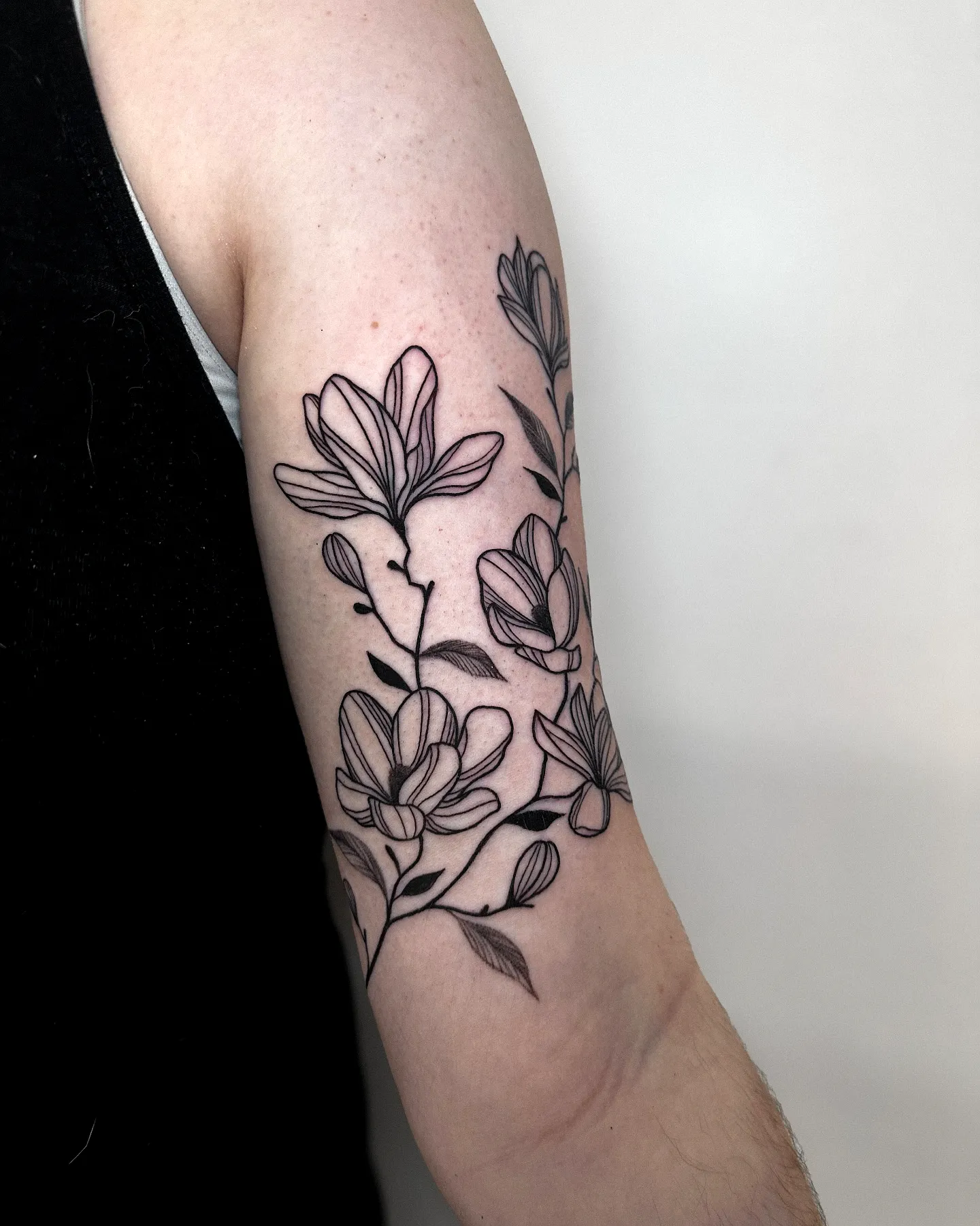 Magnolia Upper Arm Tattoo Design