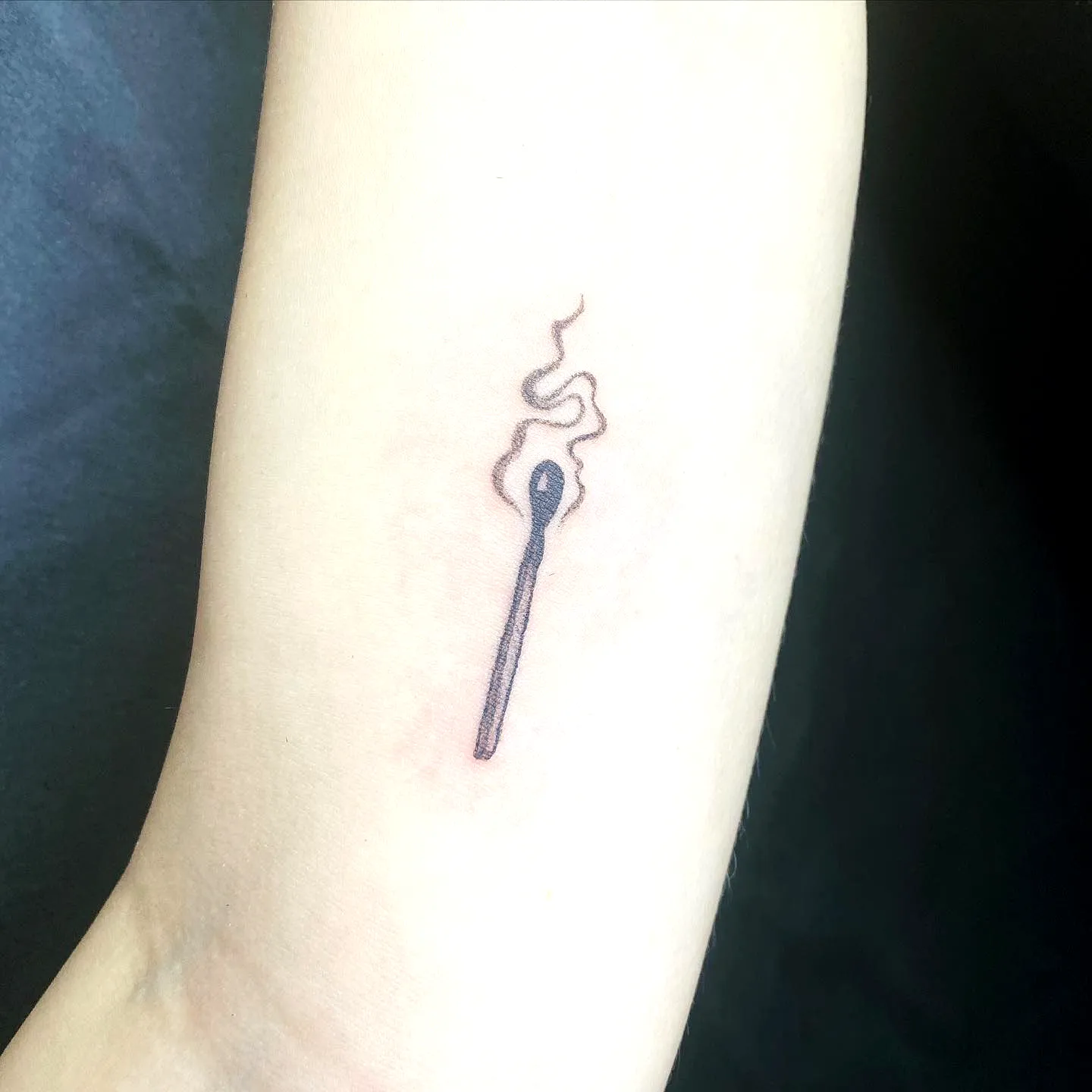 Matchstick Forearm Tattoo with Smoke