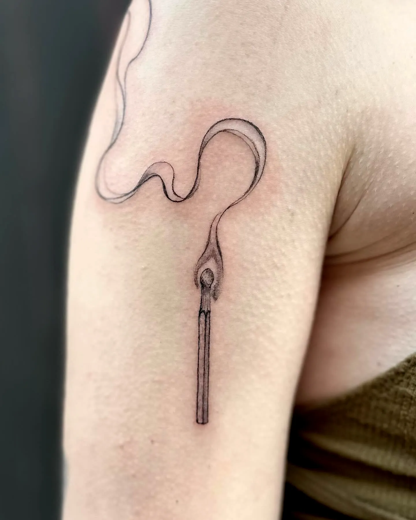 Matchstick Minimalist Upper Arm Tattoo