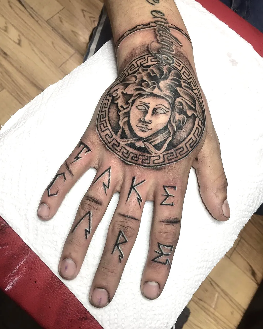 Medusa Hand Tattoo with Runes in Black