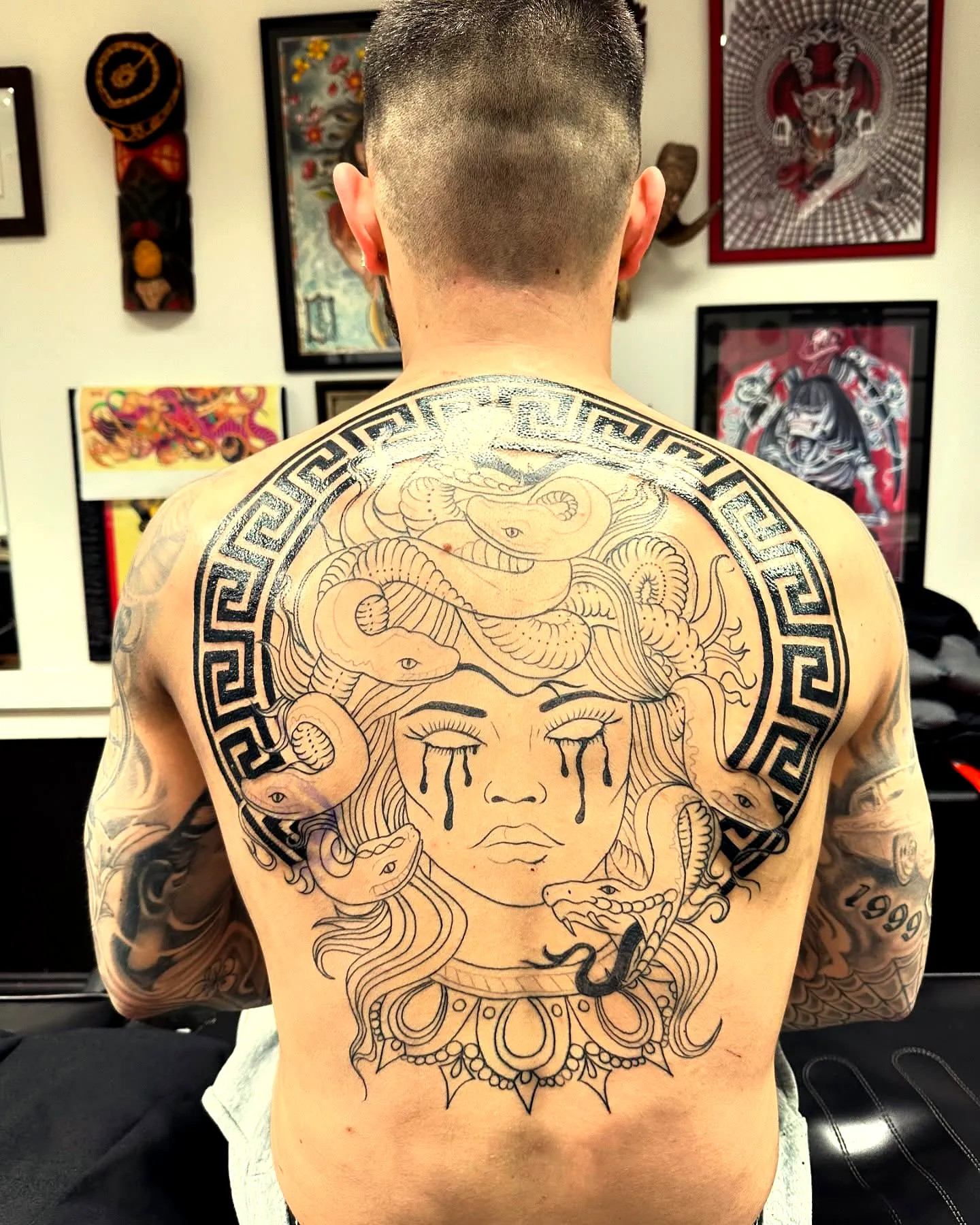 Medusa Upper Back Tattoo with Greek Patterns