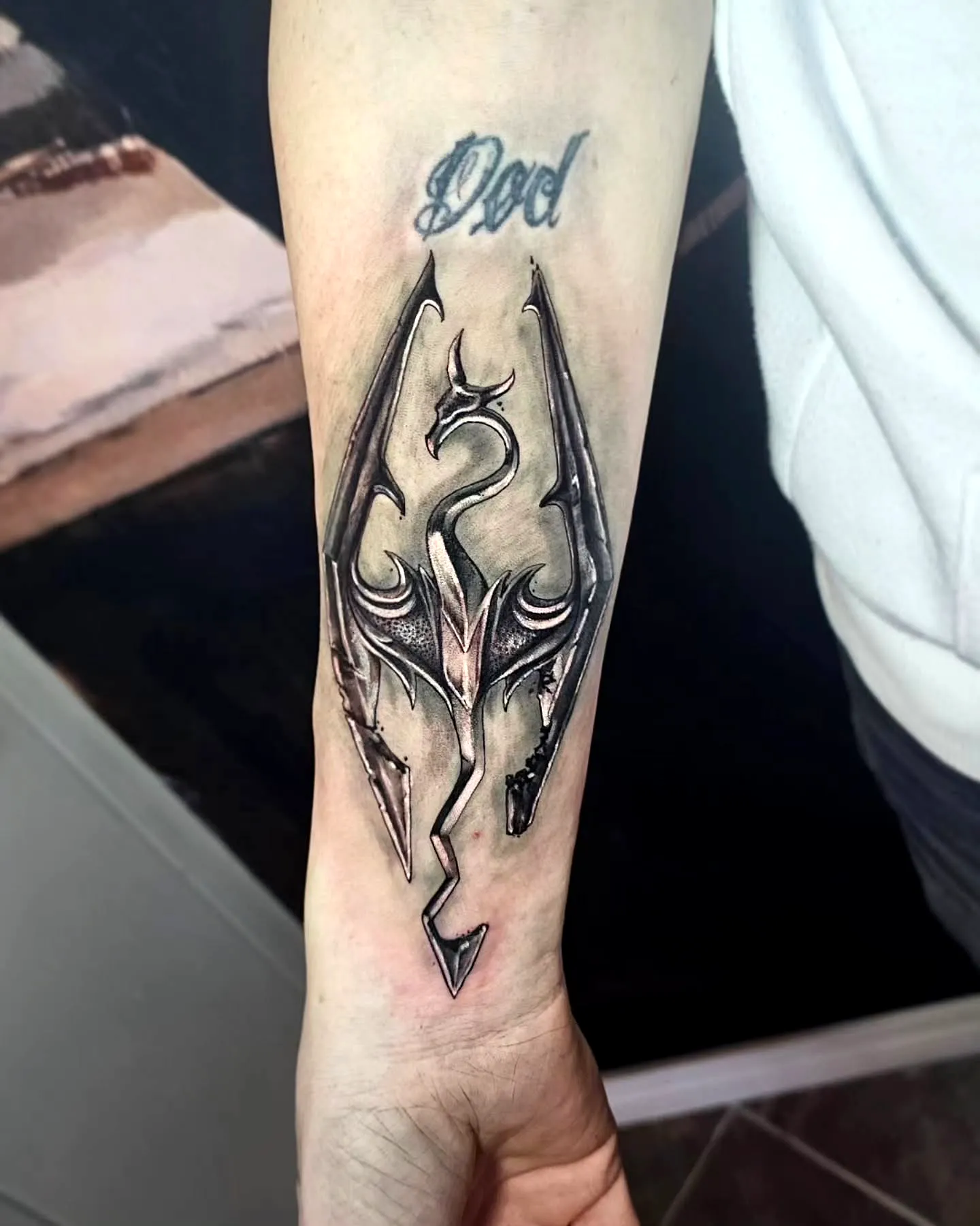 Metallic Dragon Forearm Tattoo