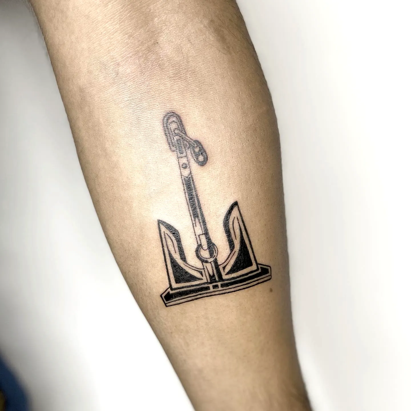Minimalist Anchor Forearm Tattoo