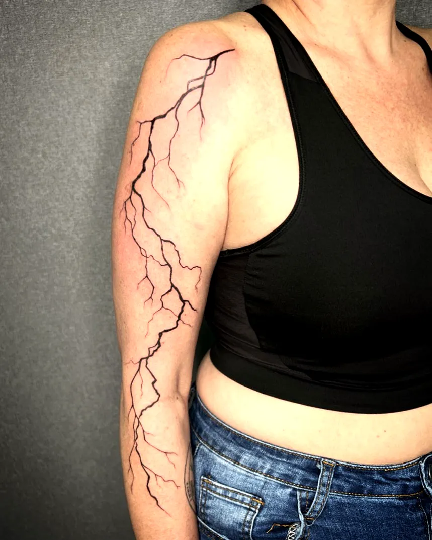 Minimalist Black Lightning Arm Tattoo