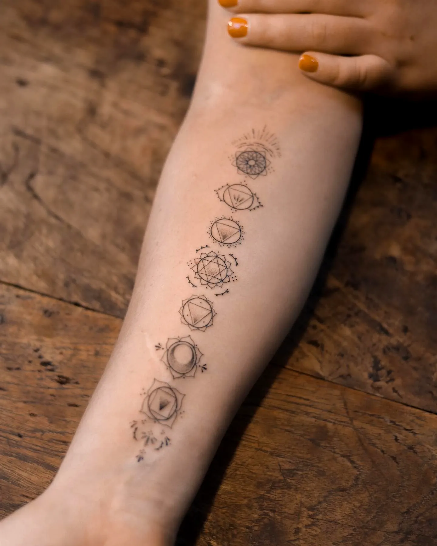 Minimalist Chakra Forearm Tattoo