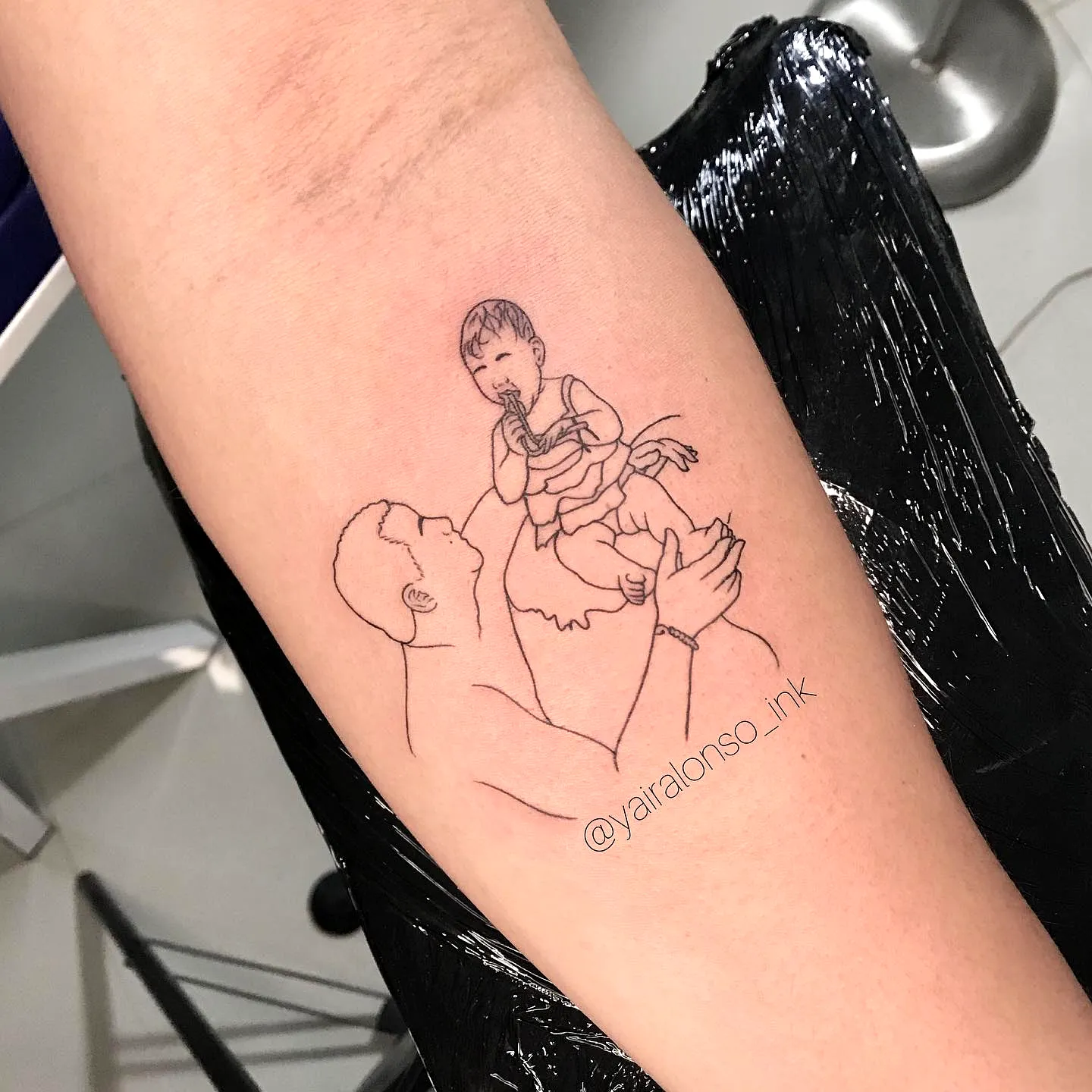 Minimalist Father Child Silhouette Arm Tattoo