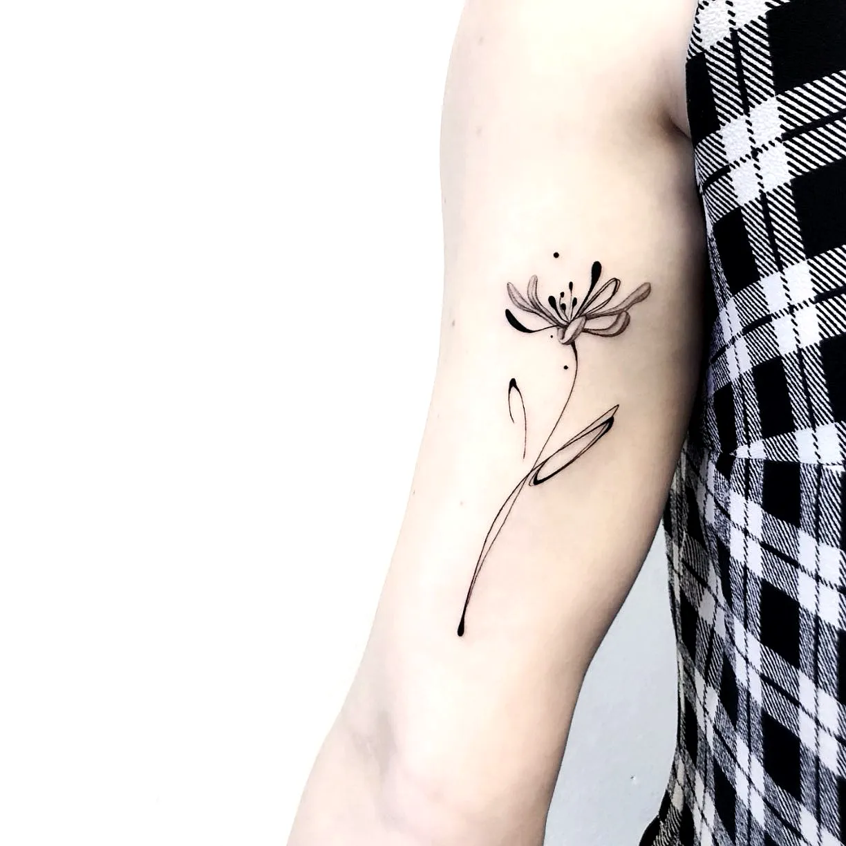 Minimalist Flower Upper Arm Tattoo