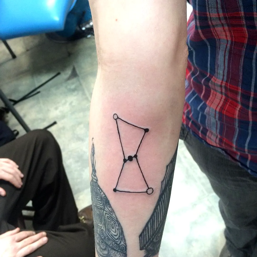 Minimalist Hourglass Forearm Tattoo