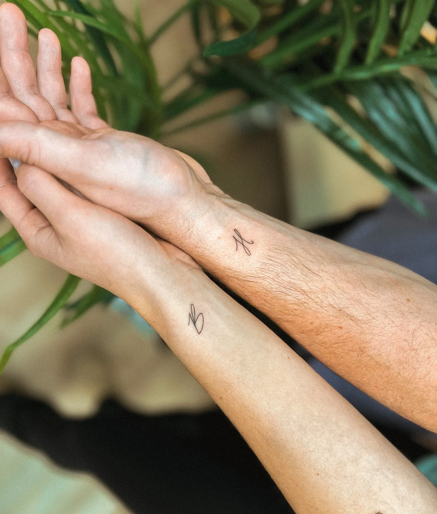 Minimalist Initial Tattoos on Wrists
