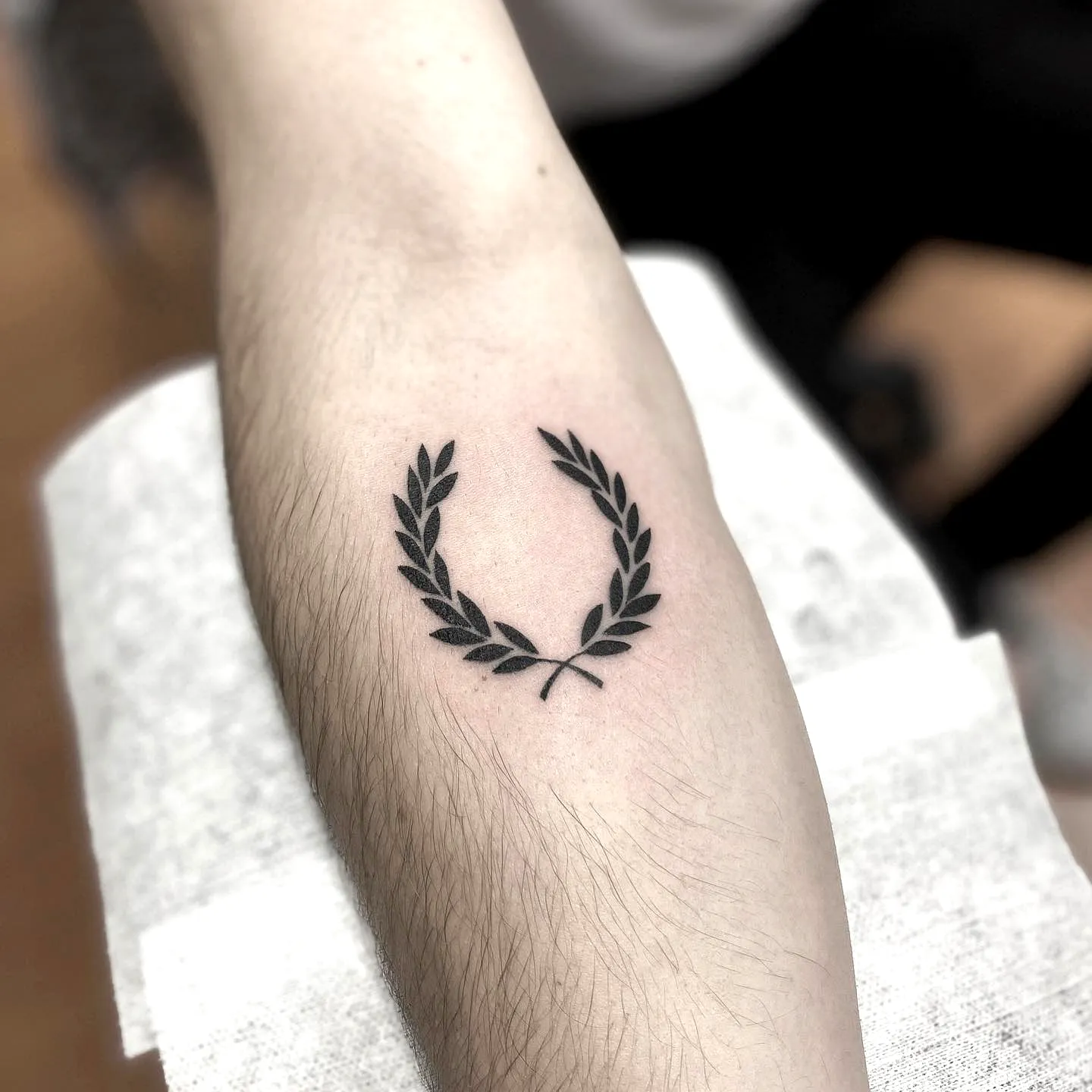 Minimalist Laurel Wreath Forearm Tattoo