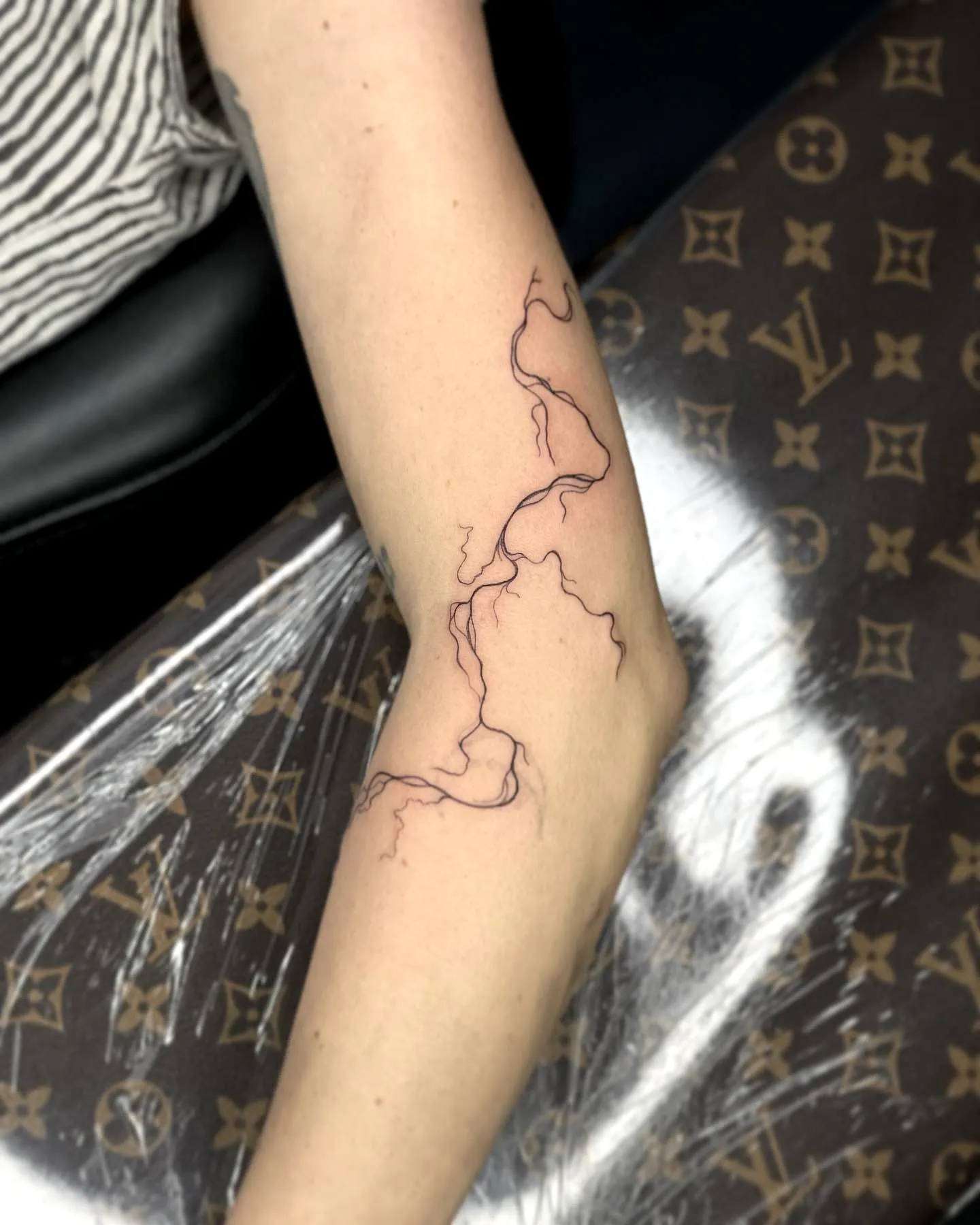 Minimalist Lightning Bolt Forearm Tattoo
