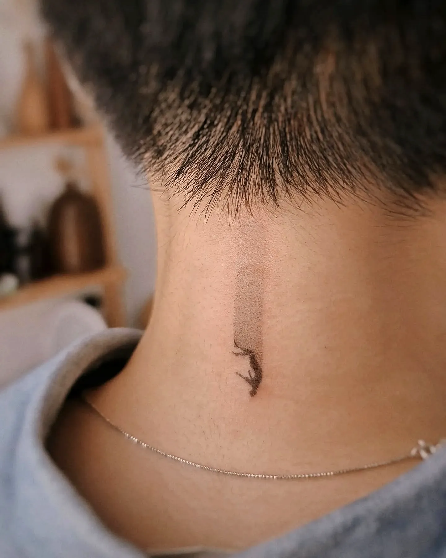 Minimalist Lizard Neck Tattoo