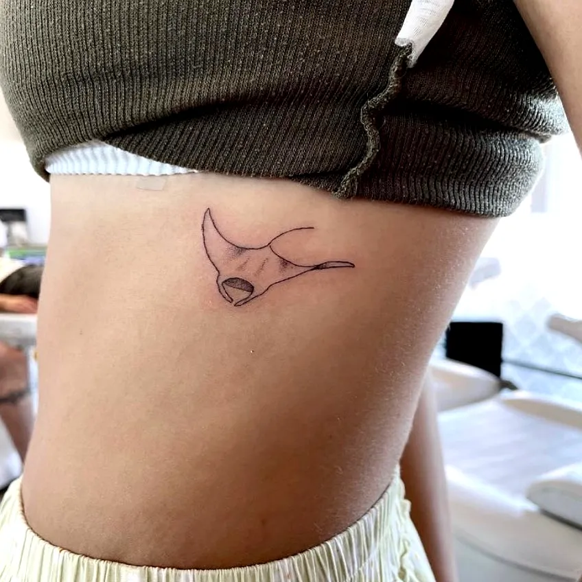 Minimalist Manta Ray Rib Tattoo