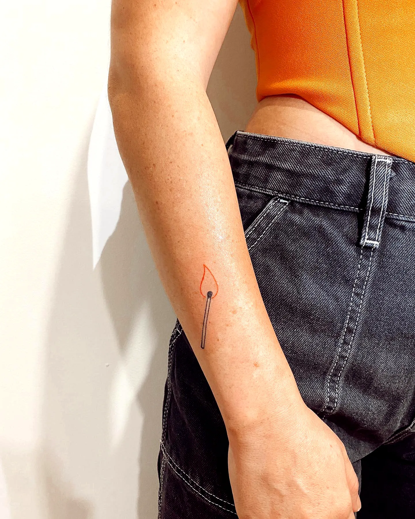 Minimalist Matchstick Forearm Tattoo