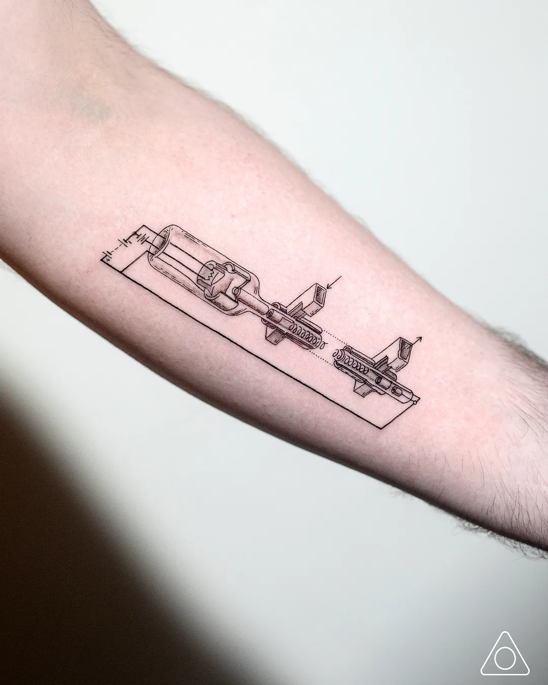 Minimalist Mechanical Tool Forearm Tattoo