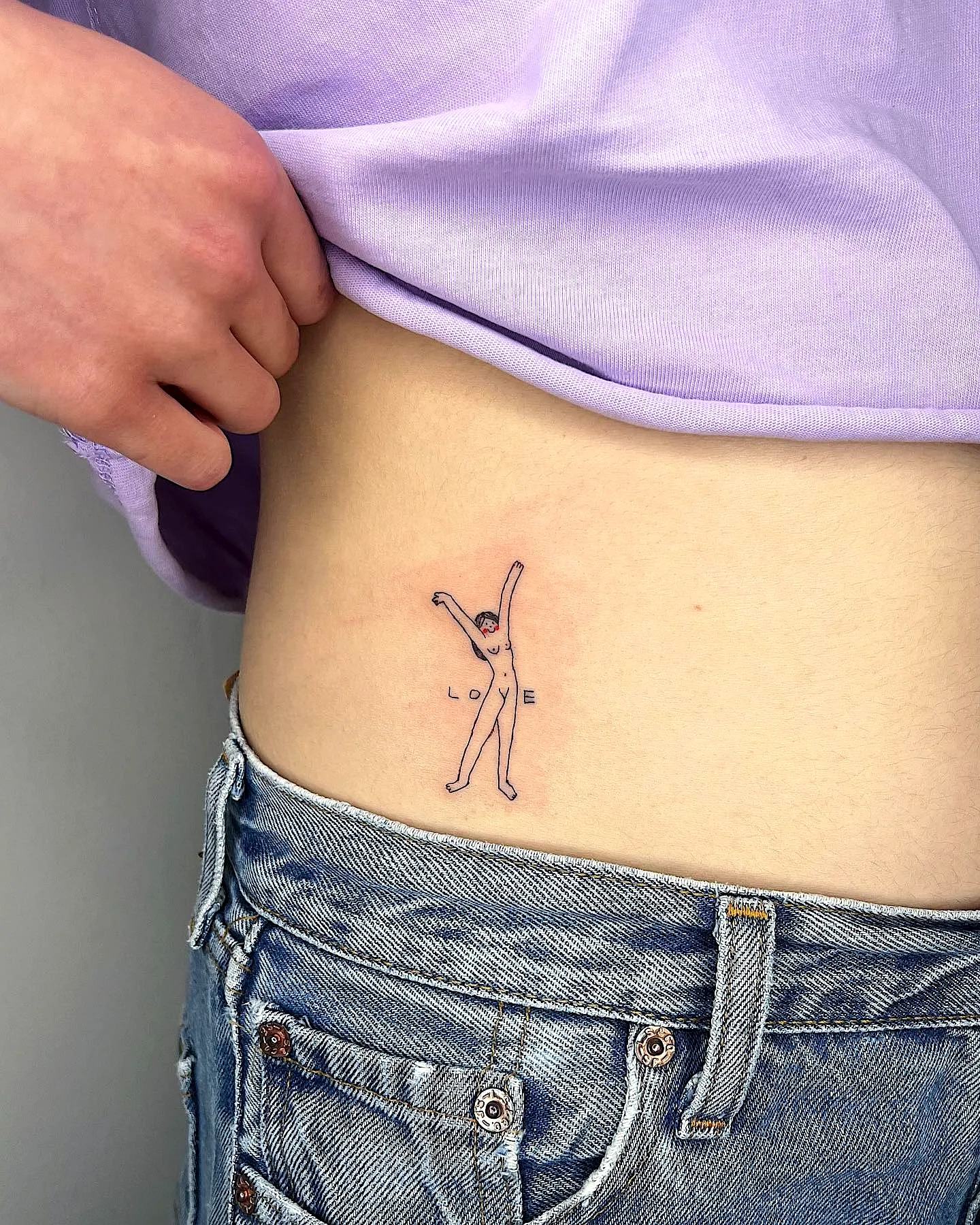 Minimalist Rib Tattoo with Love Design