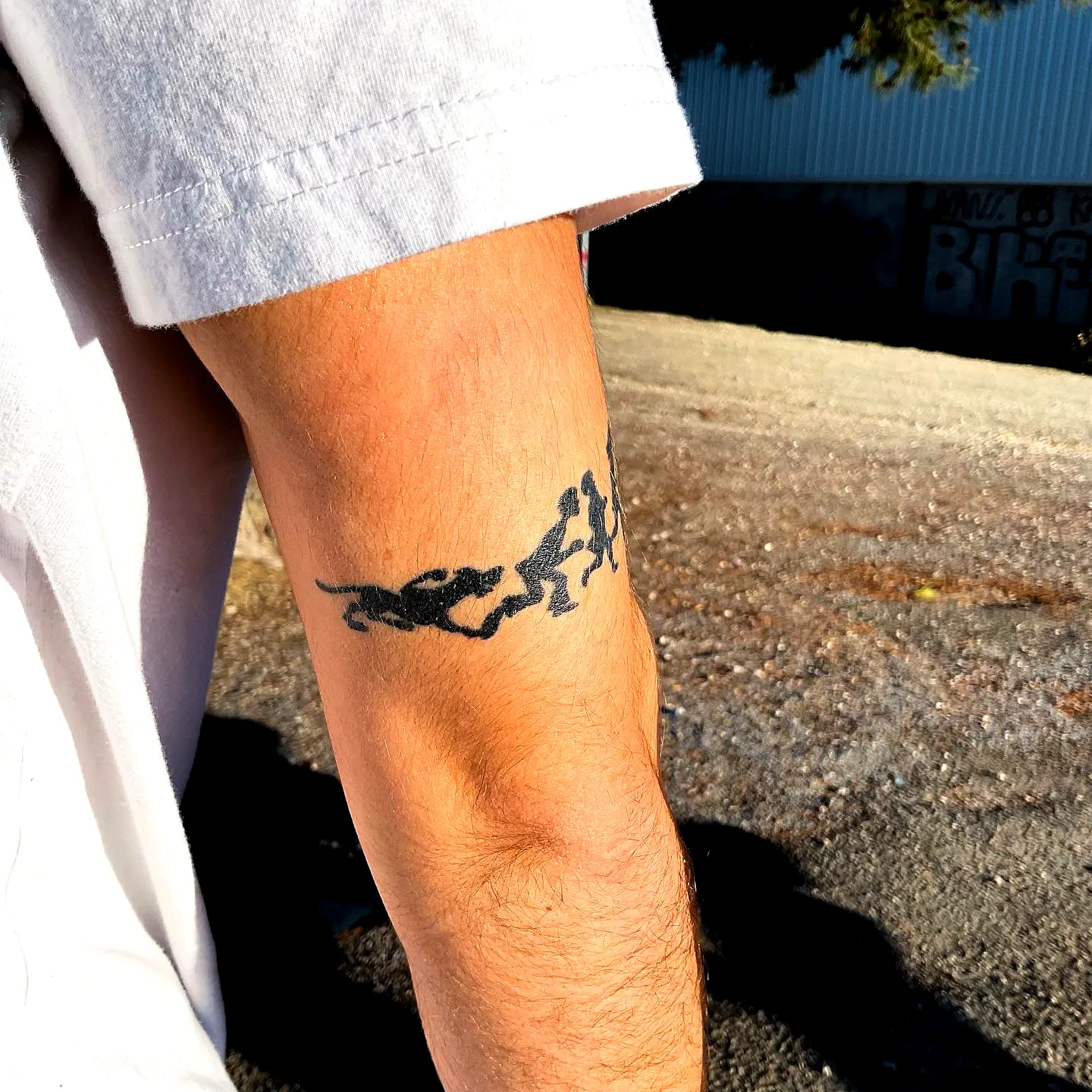 Minimalist Running Dogs Forearm Tattoo