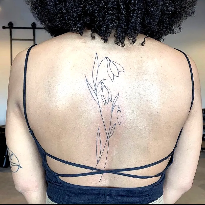 Minimalist Snowdrop Upper Back Tattoo