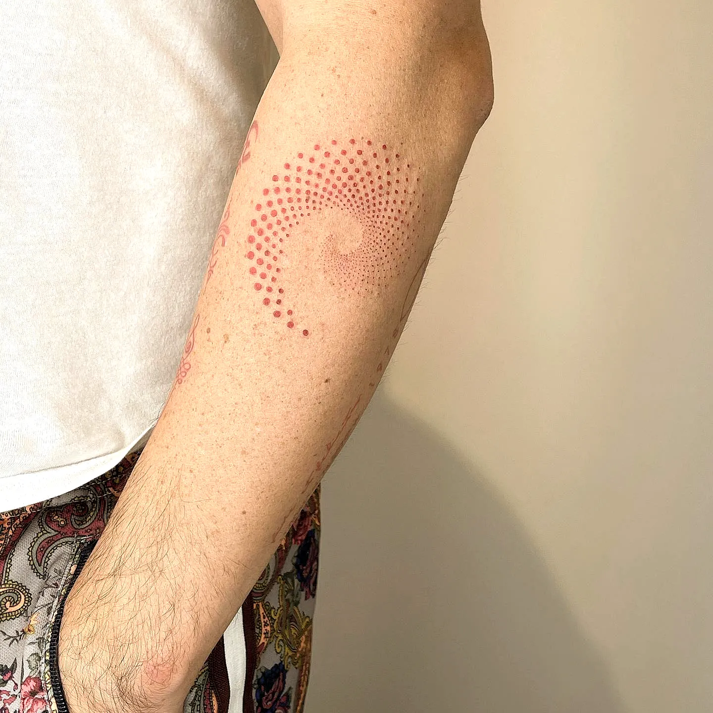 Minimalist Spiral Forearm Tattoo