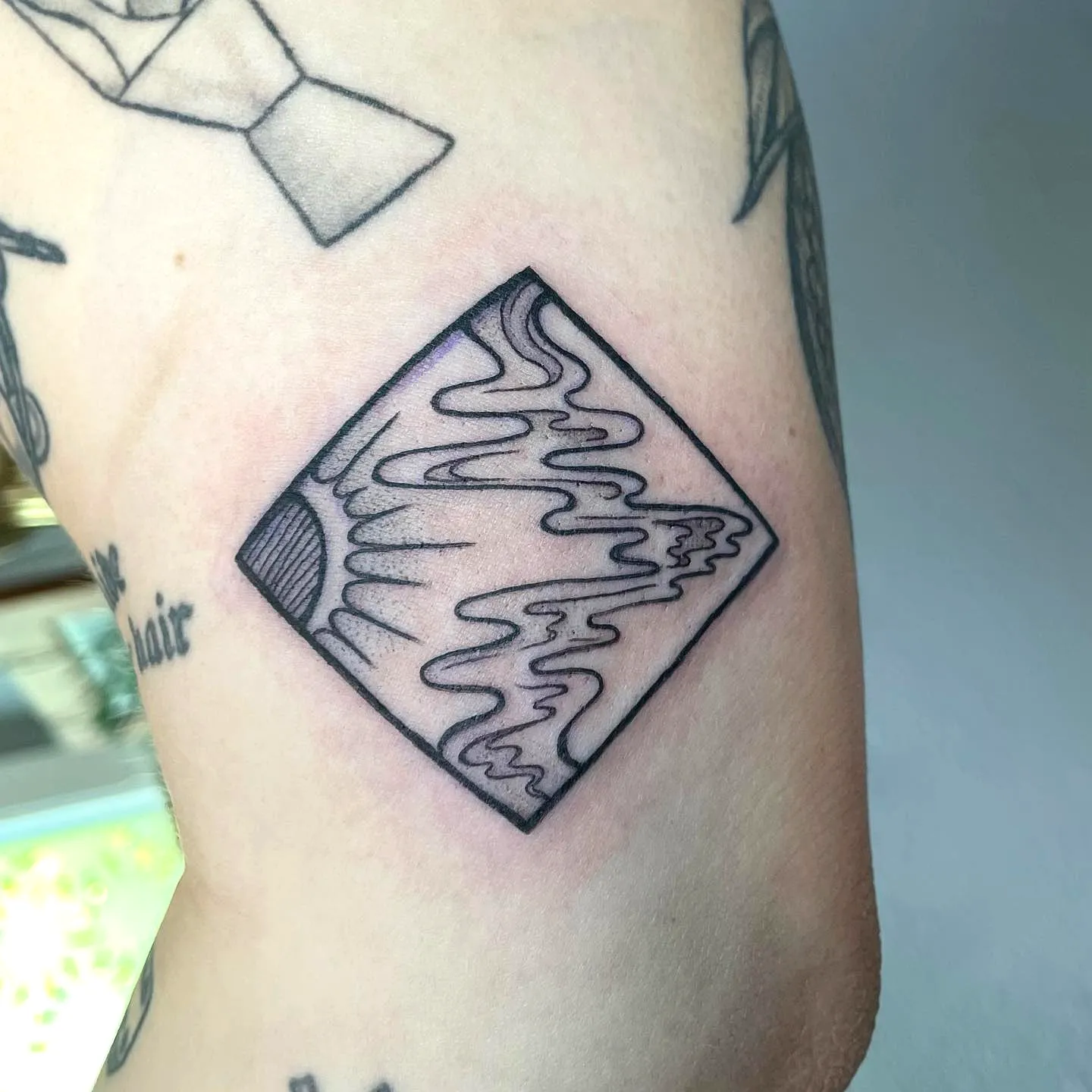 Minimalist Sun Forearm Tattoo