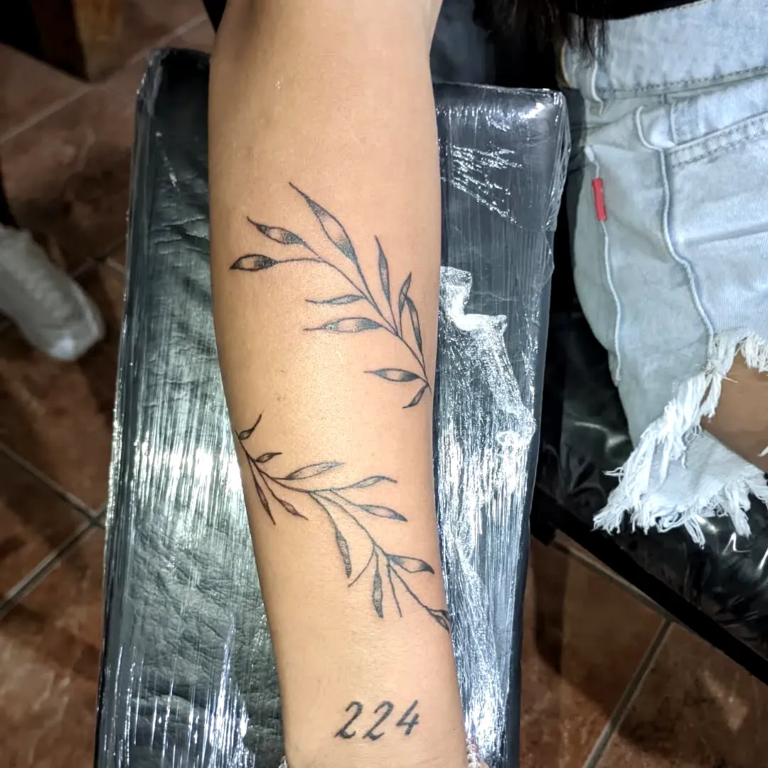 Minimalist Vine Forearm Tattoo