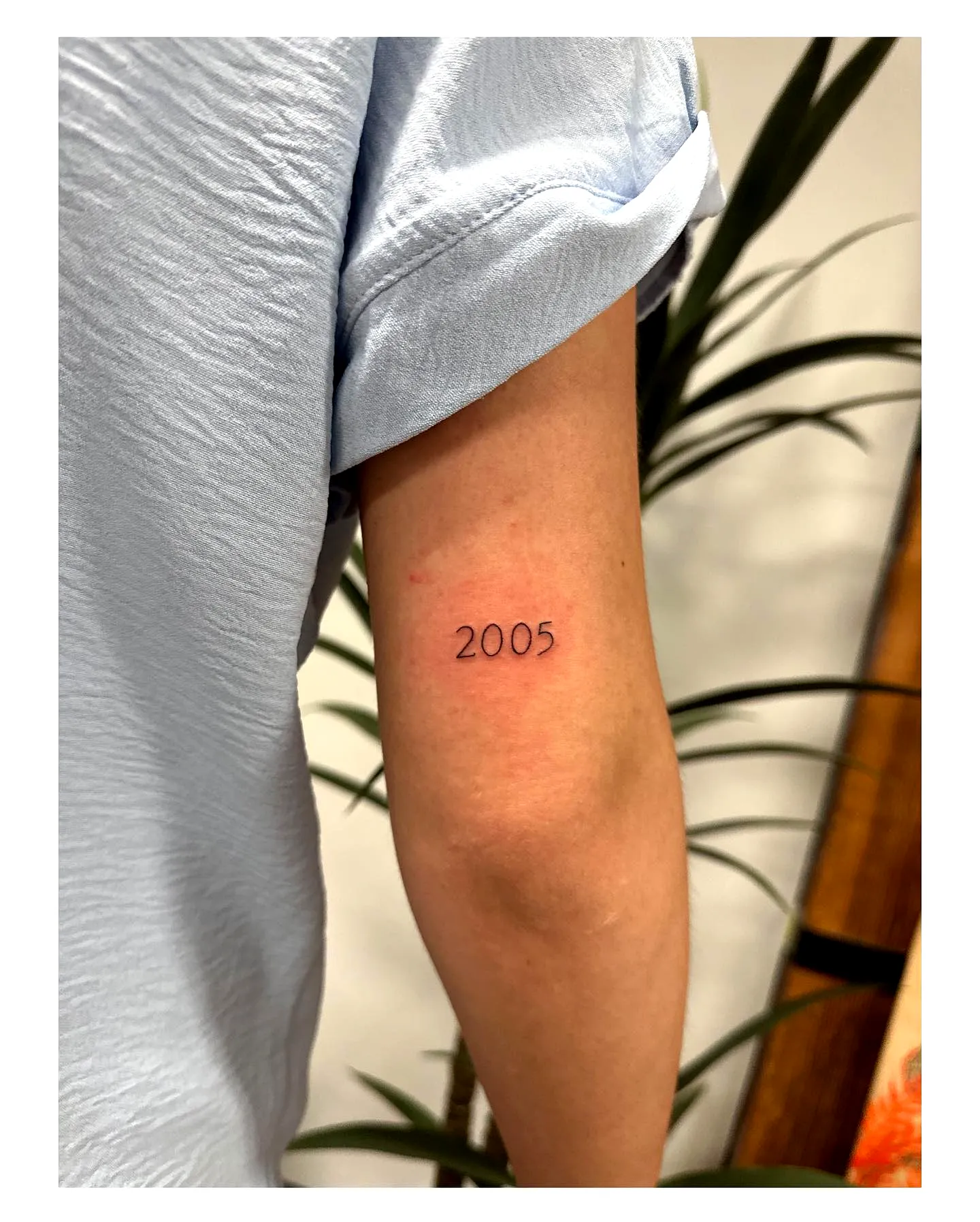 Minimalistic 2005 Inner Arm Tattoo