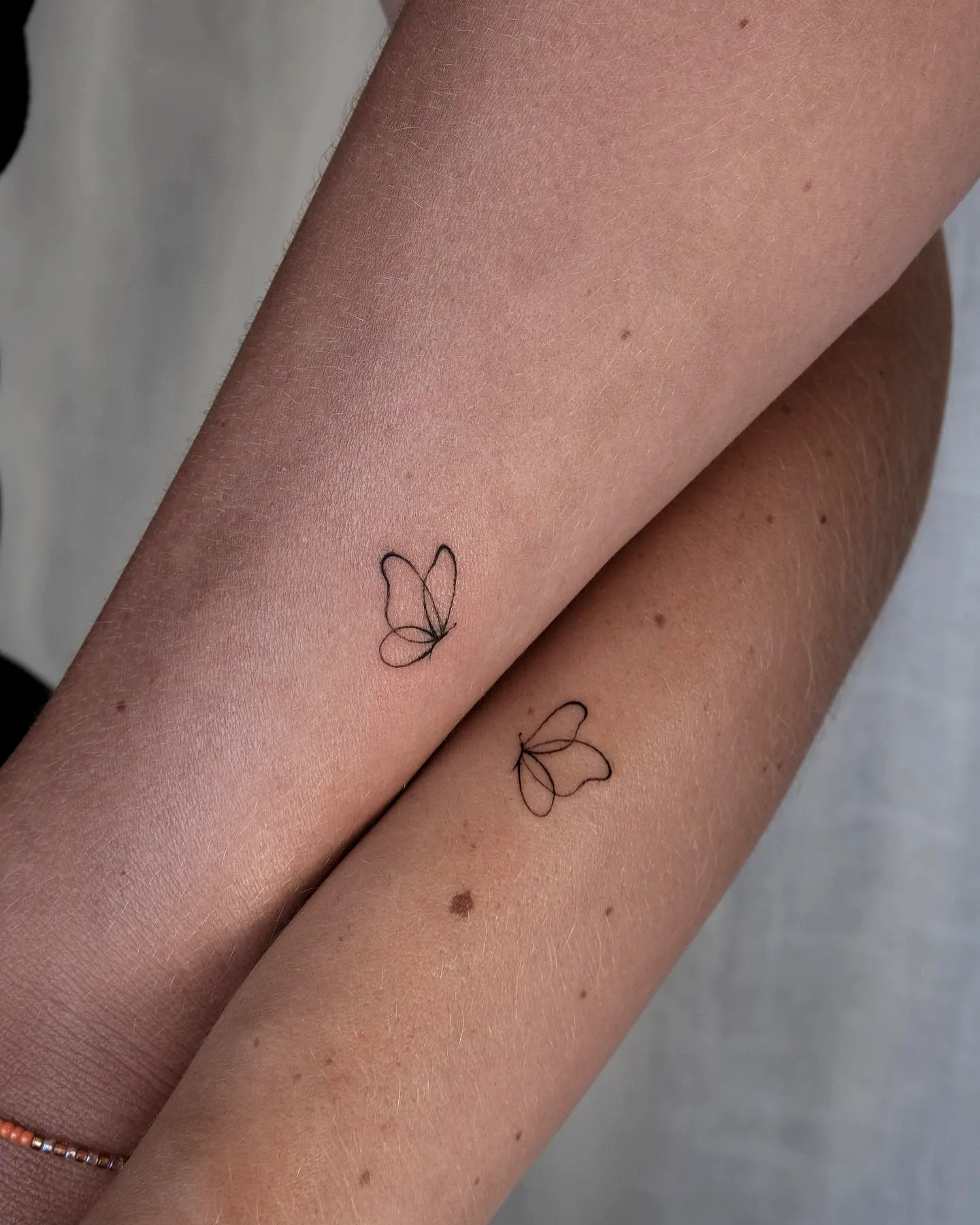 Minimalistic Butterfly Arm Tattoos