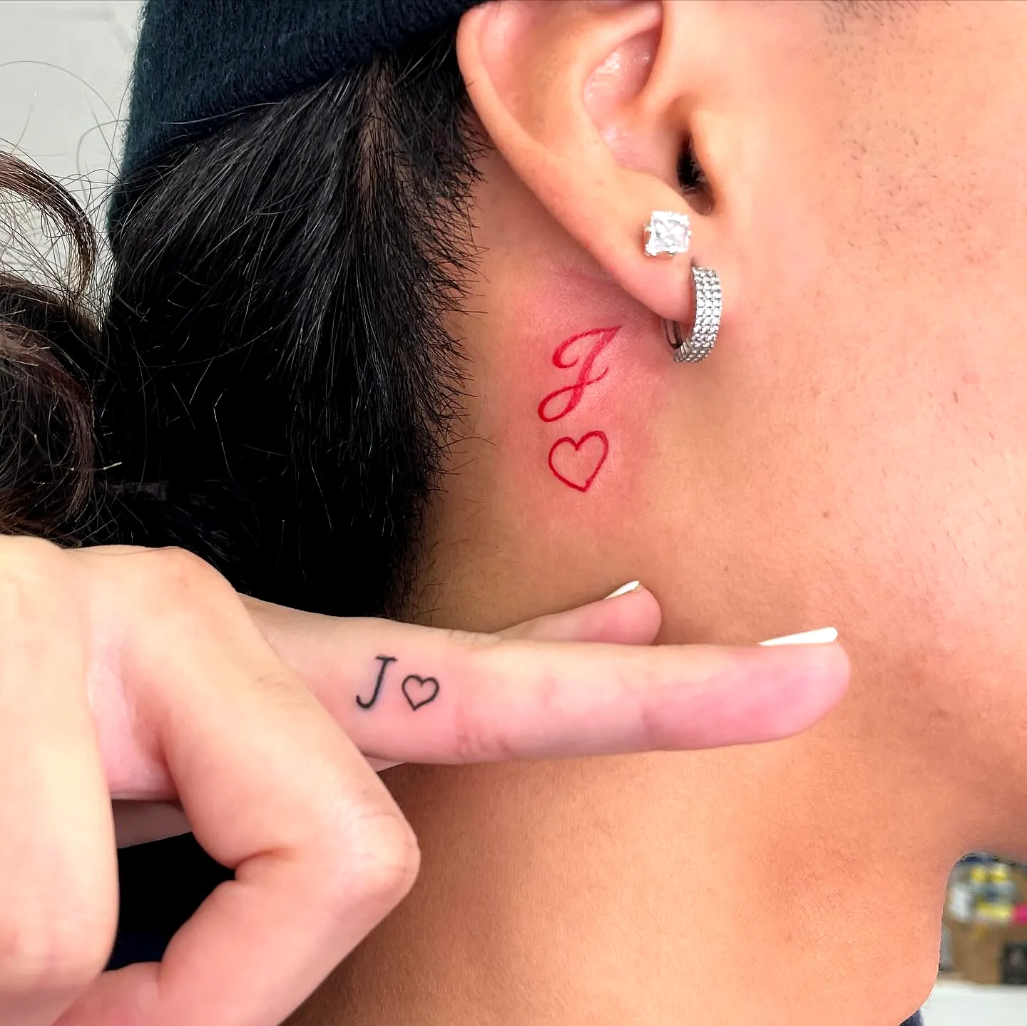 Minimalistic J Heart Neck Tattoo