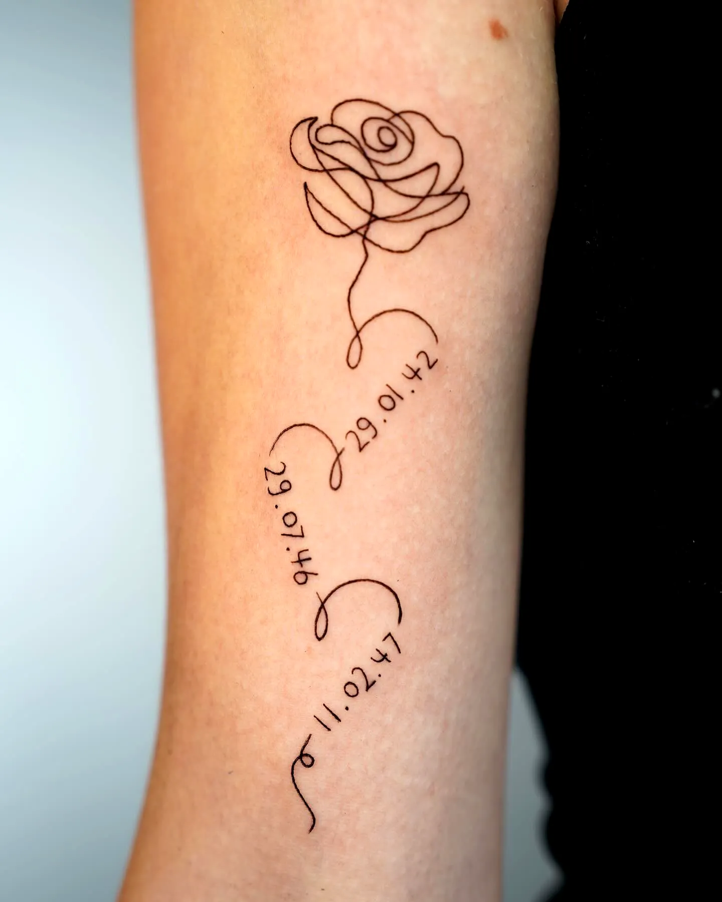 Minimalistic Rose Date Tattoo on Forearm