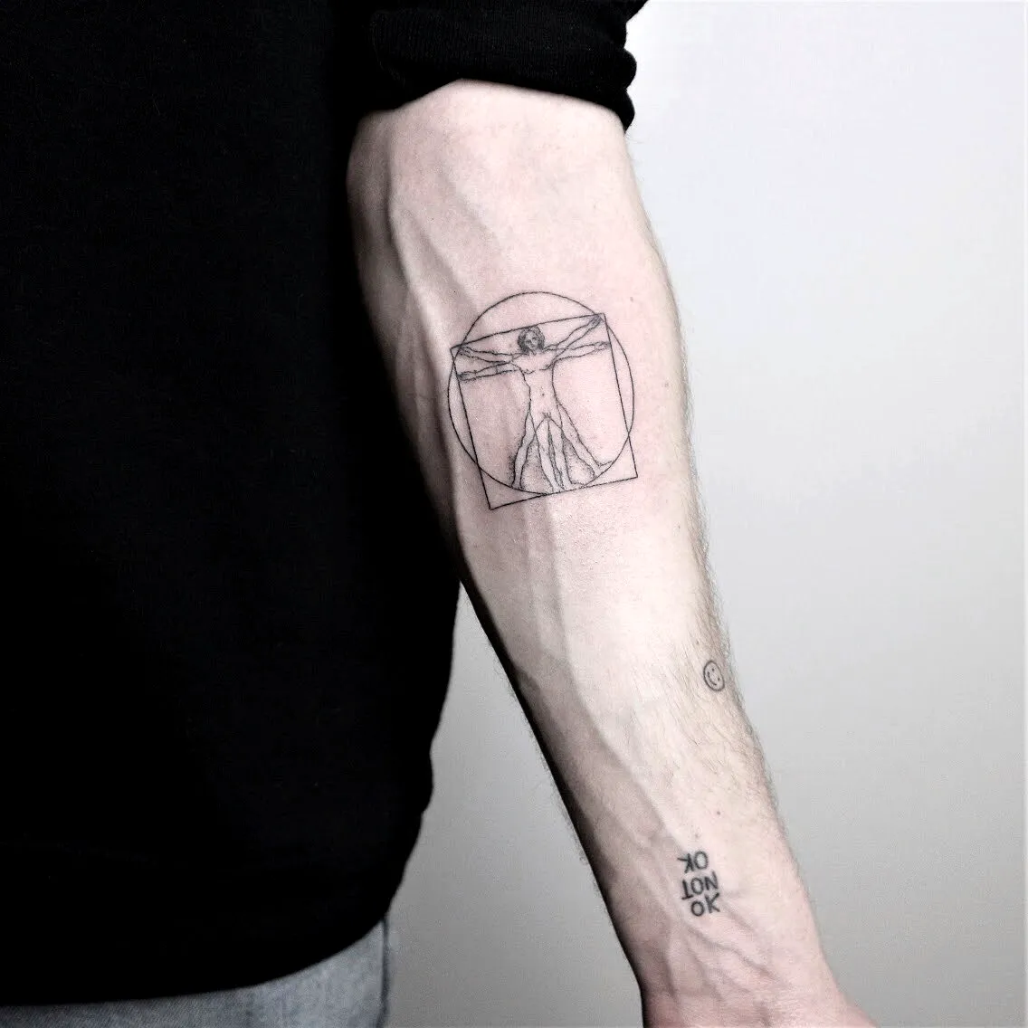 Minimalistic Vitruvian Man Forearm Tattoo