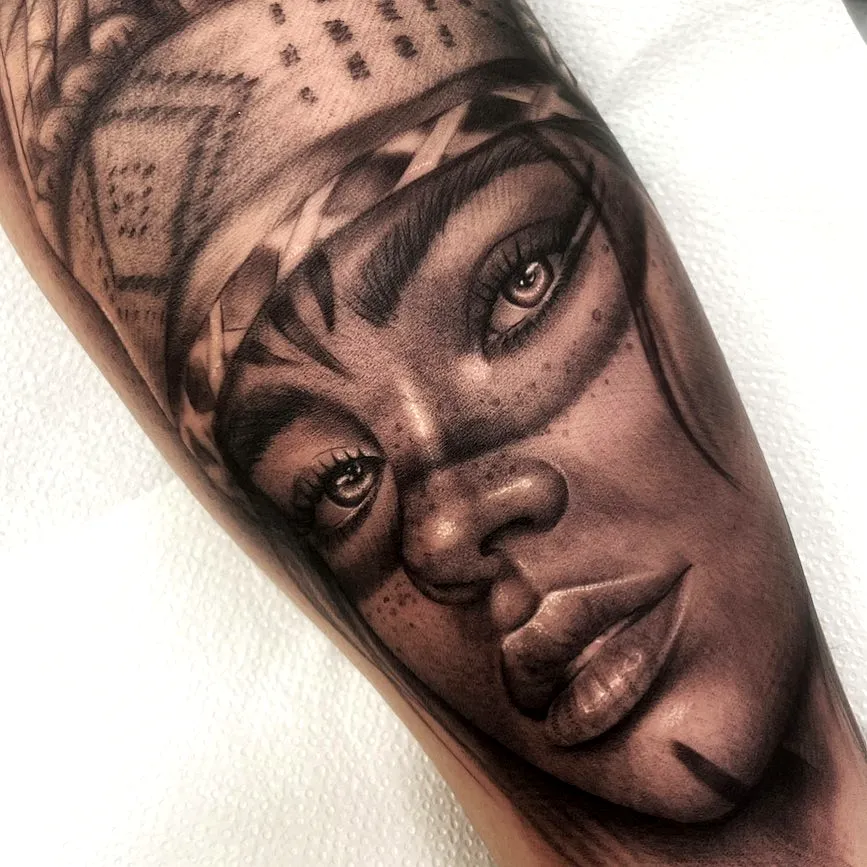 Monochromatic Woman Leg Tattoo