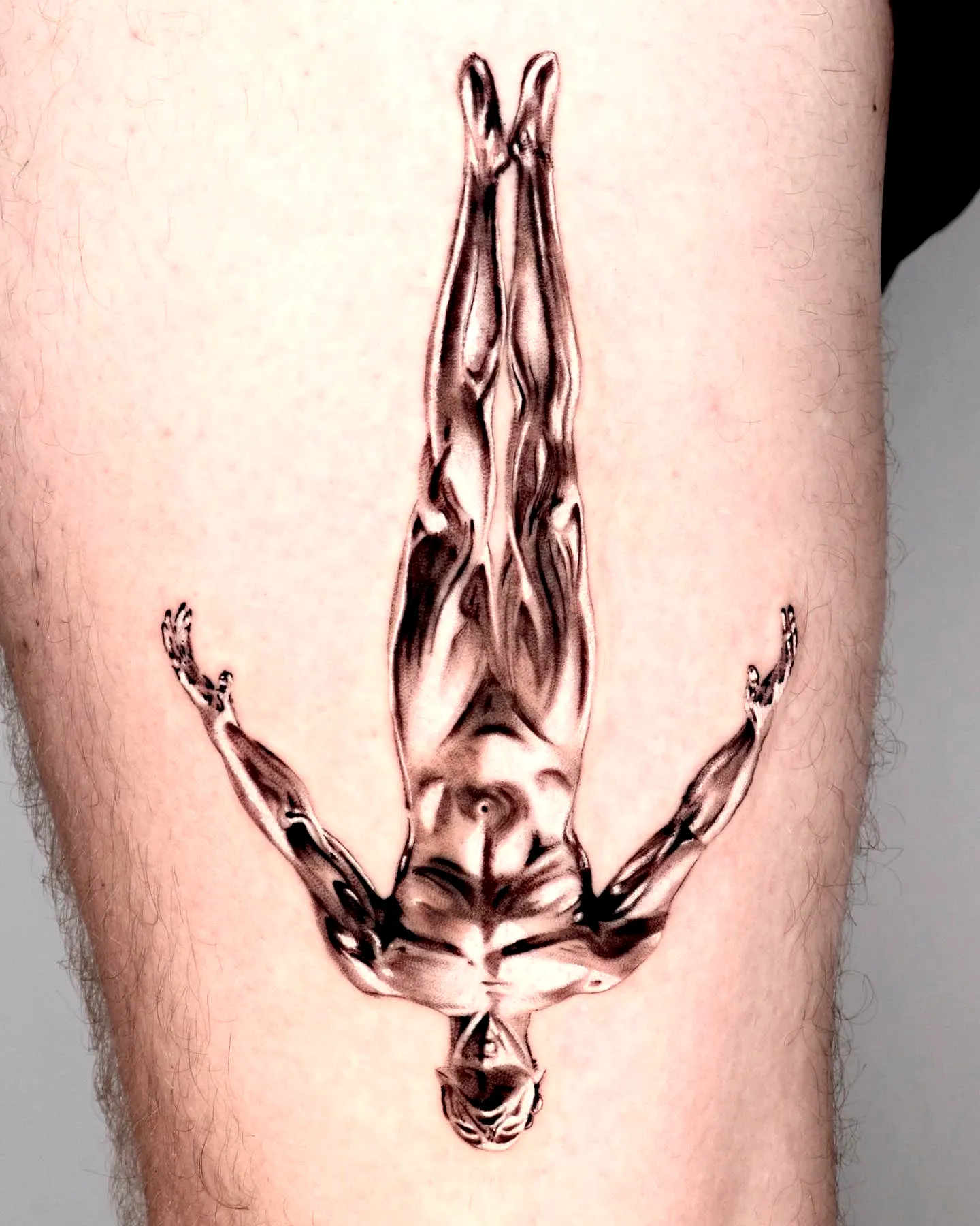 Muscular Figure Thigh Tattoo in Gray