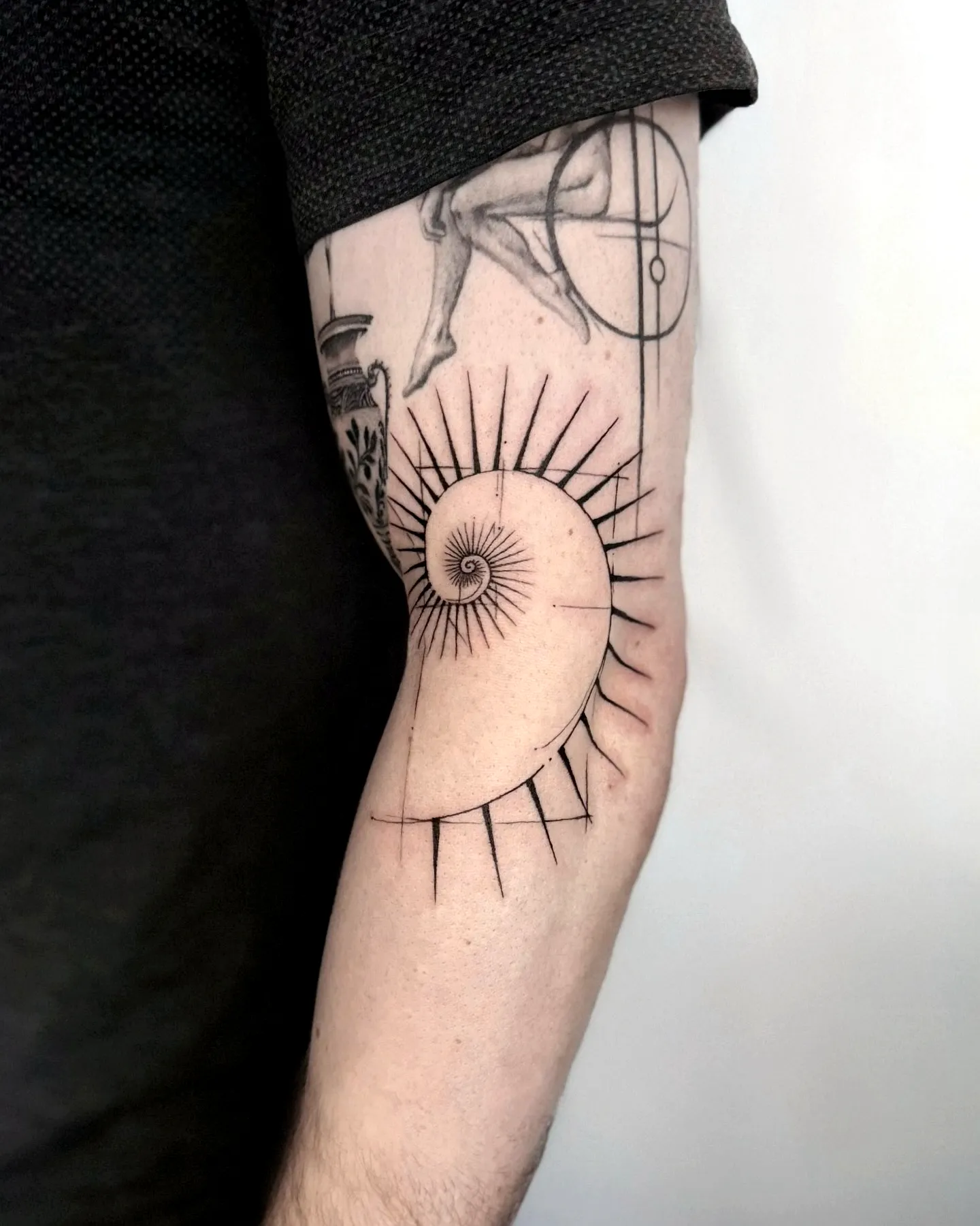 Nautilus Shell Arm Tattoo - Minimalist Design