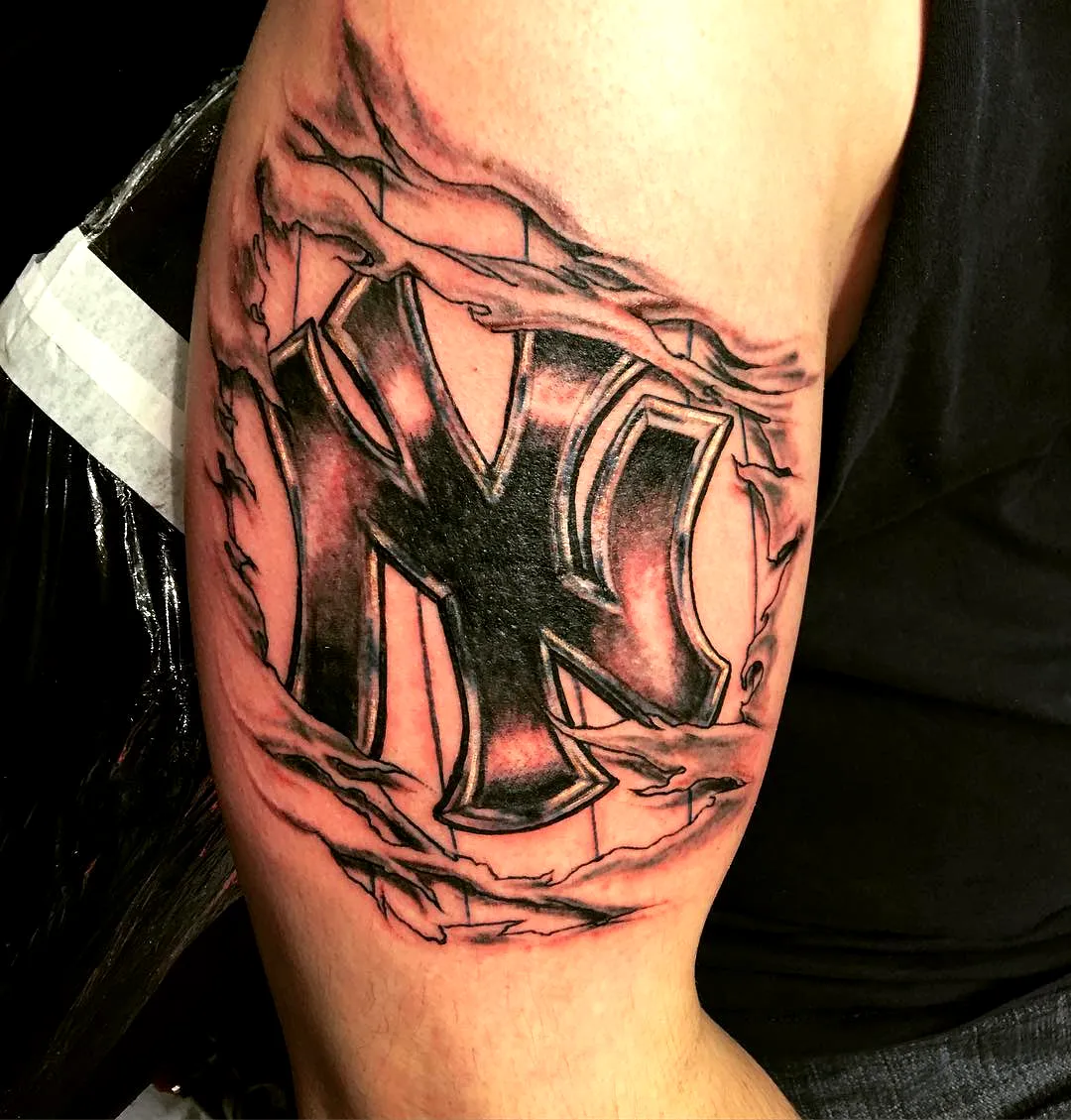 NY Logo Upper Arm Tattoo
