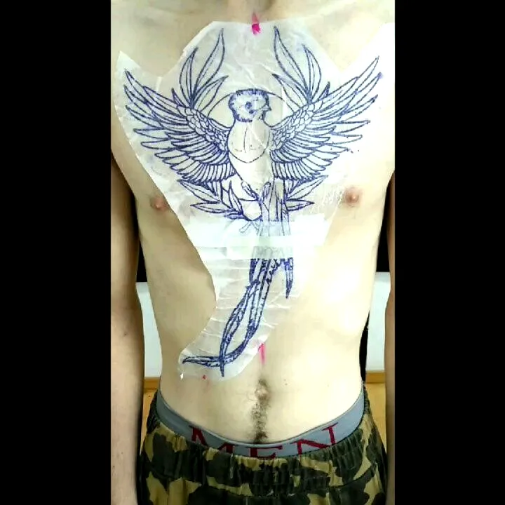 Parrot Chest Tattoo in Blue Ink